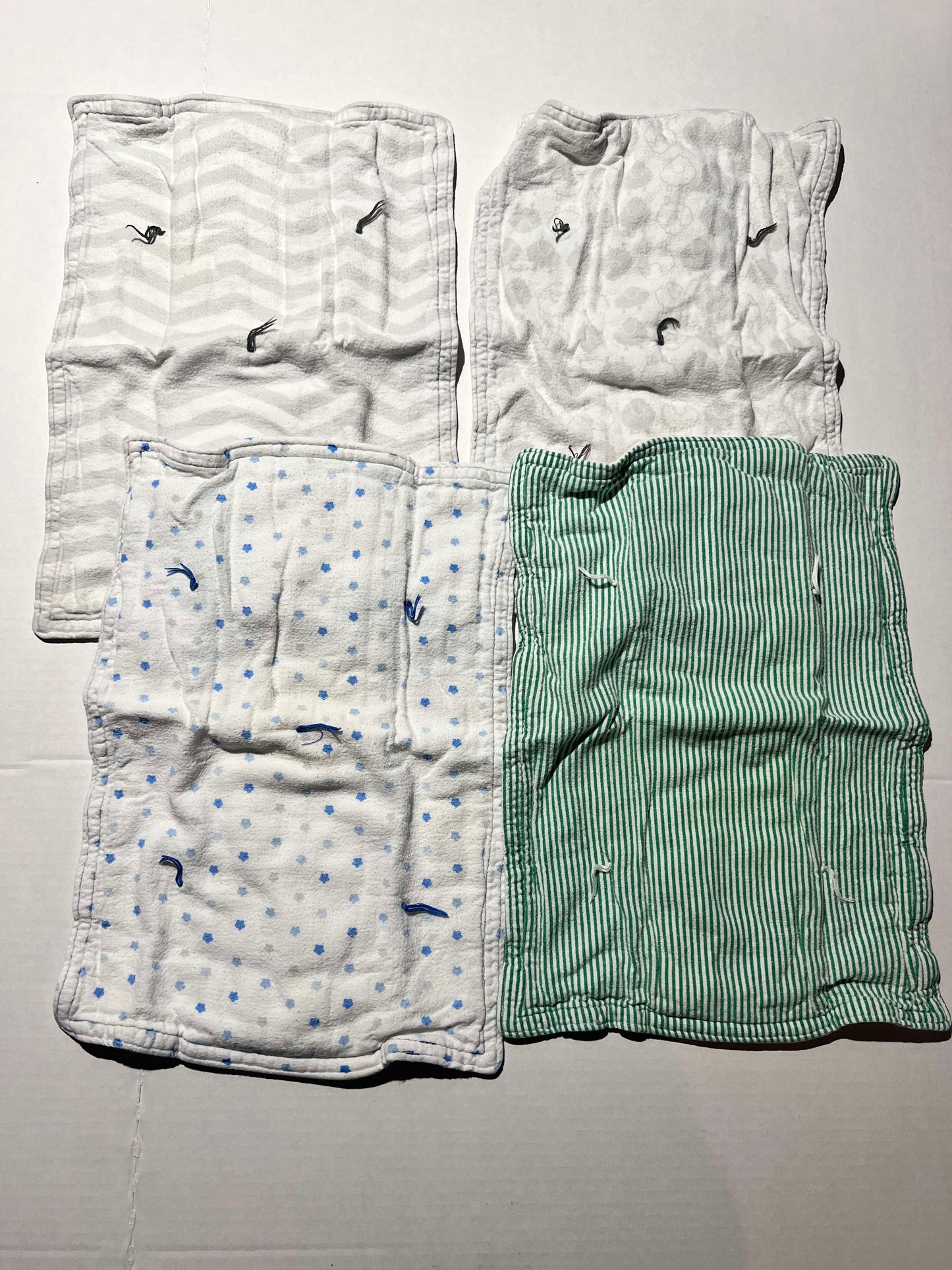 #98 Four Burp Cloths.