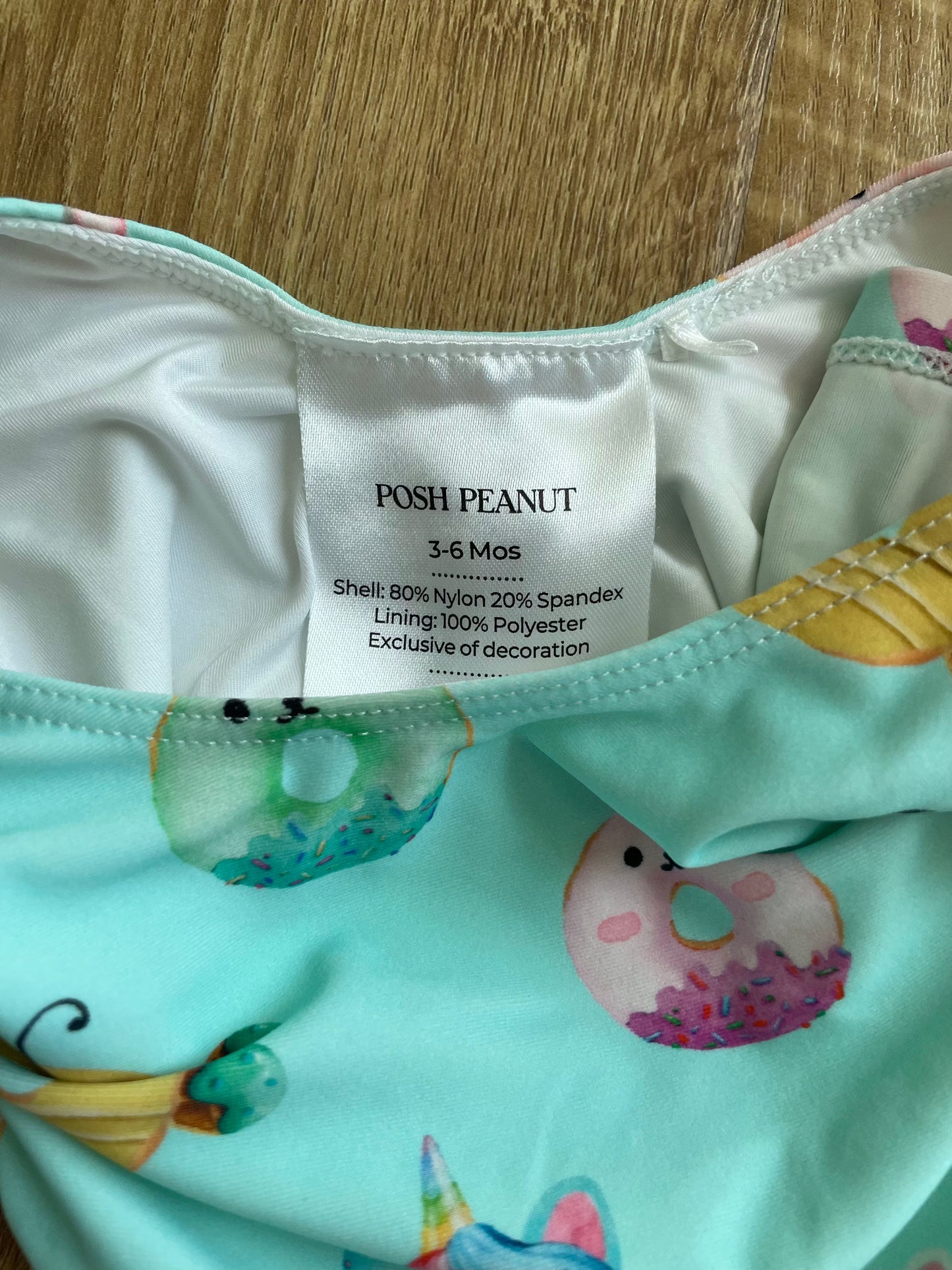 #6 - Posh Peanut Girls Ruffle Swimsuit, 3-6months, teal with donuts