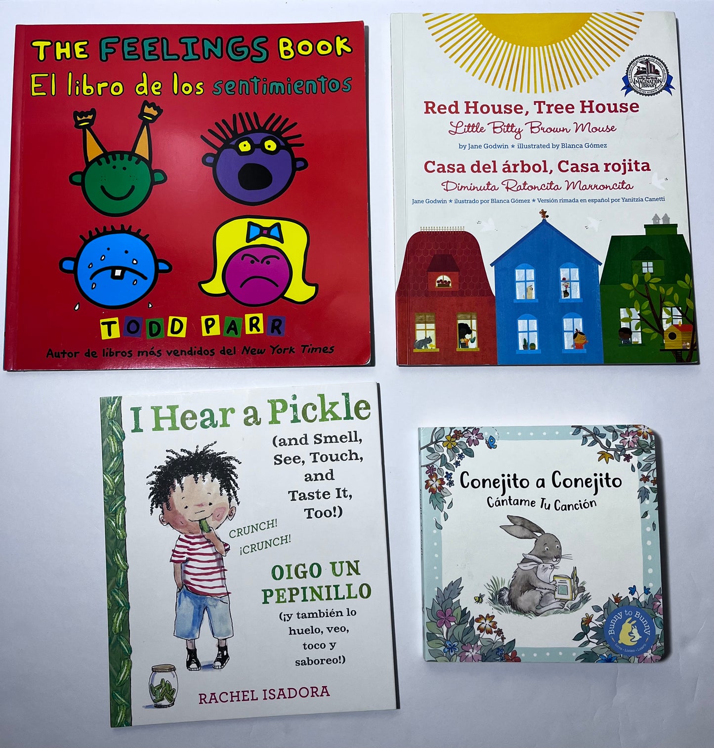 #150 lot 4 bilingual Spanish English books feelings, tree, pickle, conejito