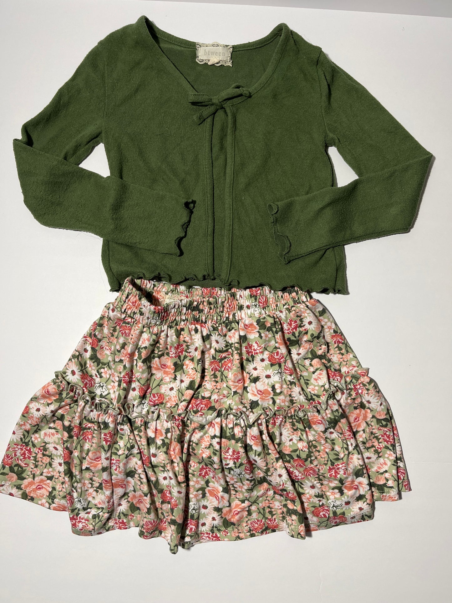 #150 girls btween size 7 green top and floral skirt