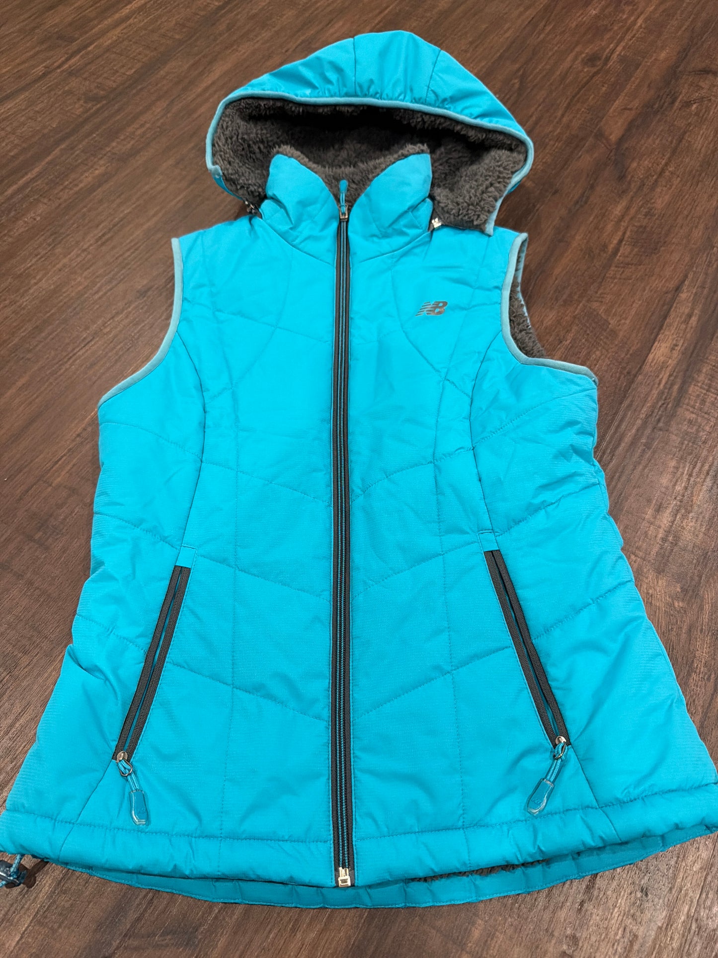 #107 womens New Balance size small vest