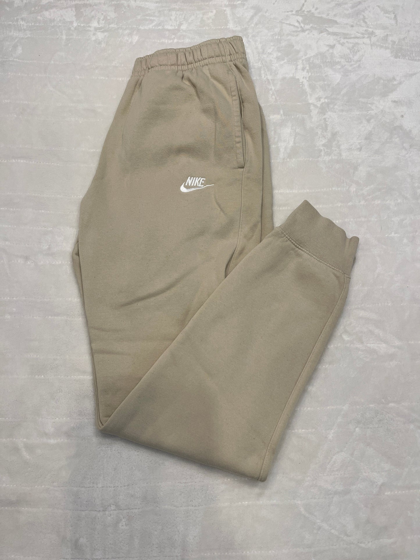 #212 Mens Nike tan joggers small tall. Not dingy looking