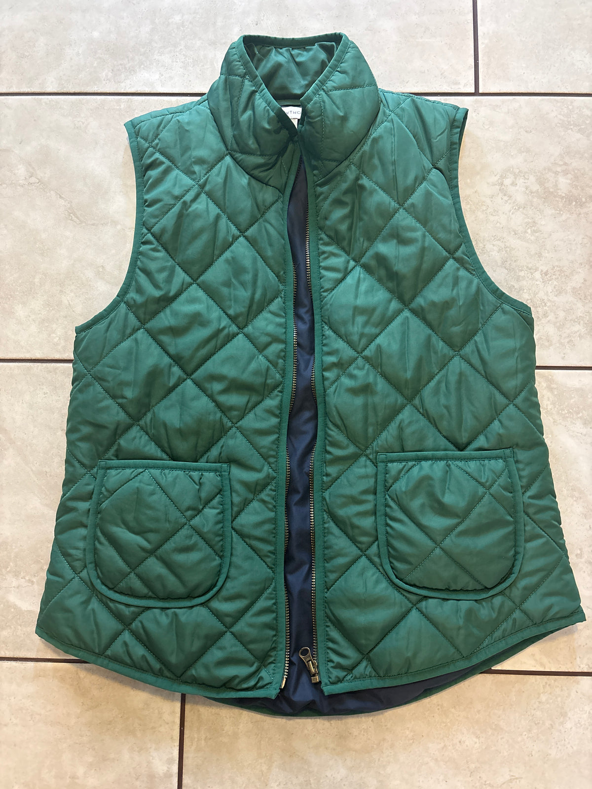 #166 women’s 41 Hawthorn M vest