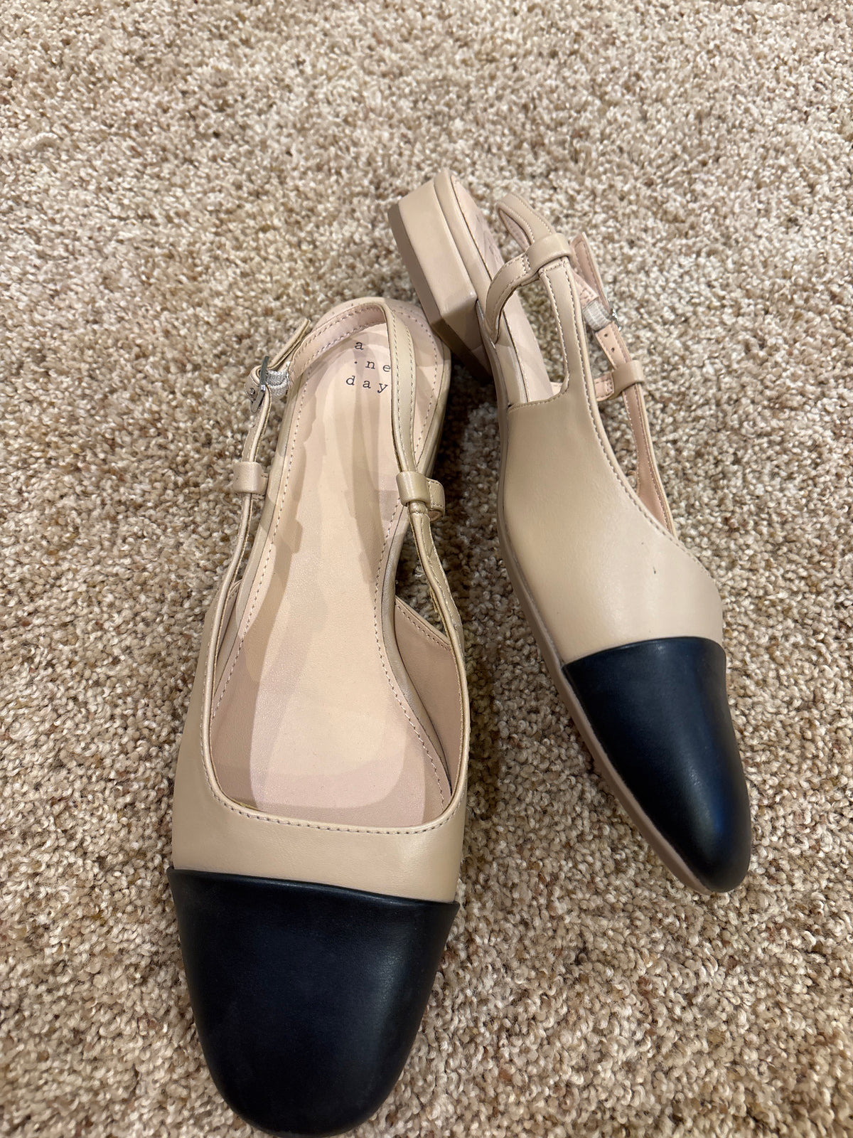 #47 women’s shoe size 8.5, tan and black dress shoe, a new day brand.