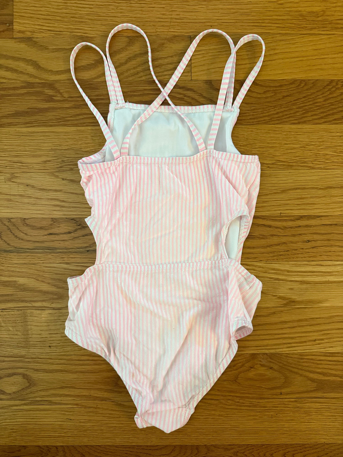 Seller #152 - girls size 5-6T light pink and white swimsuit with side cut outs