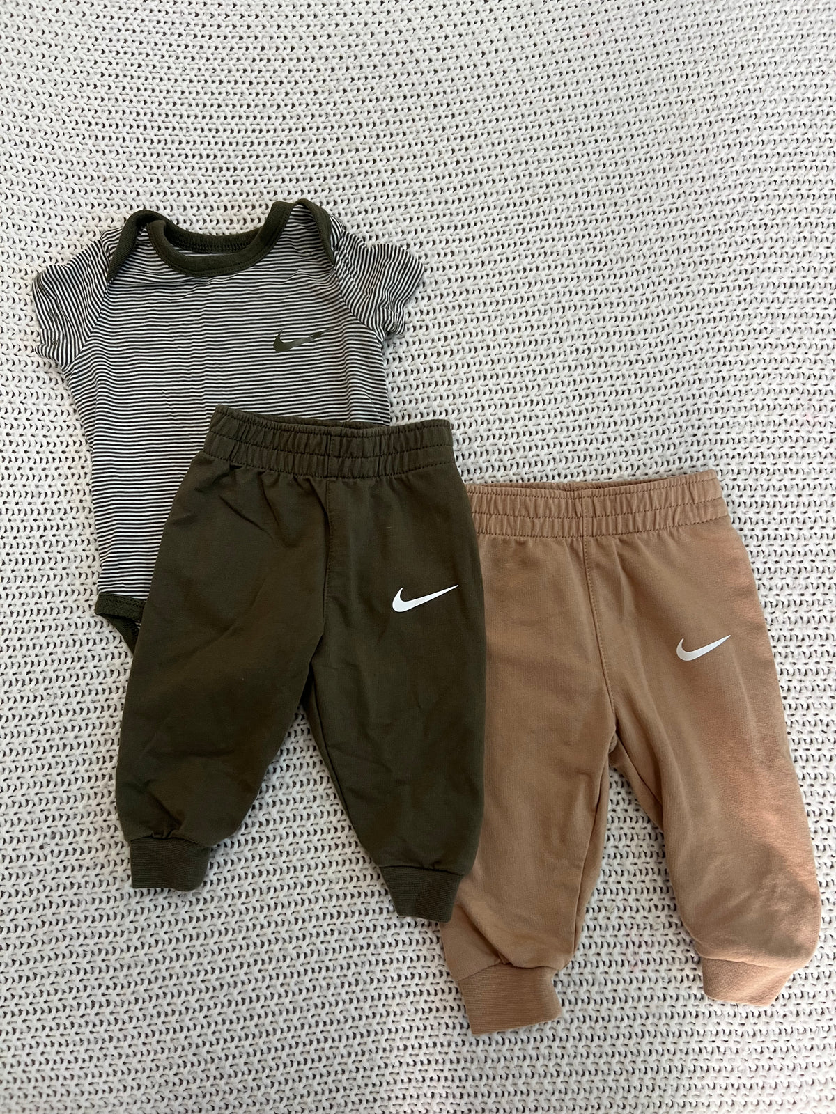 #157 Nike Onesie with 3M green body suit and pants and 6M brown pants