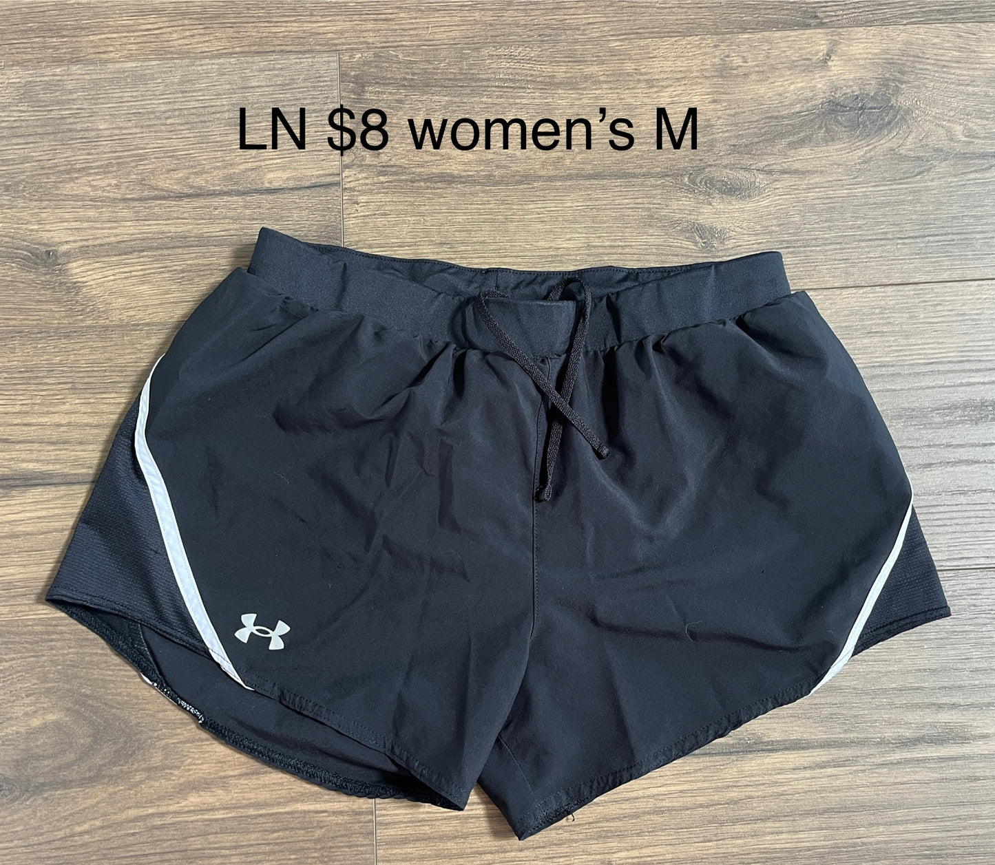 137 2 Pairs of Women's Under armour shorts Black and white Size M (MULTIPLE PICS)