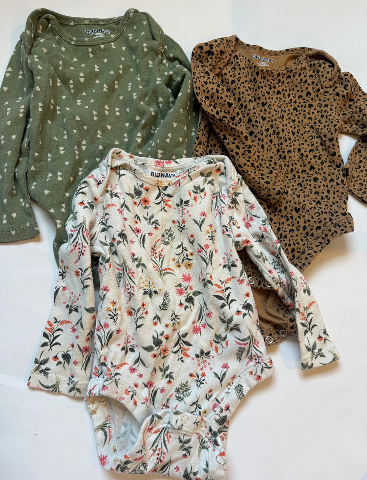 #170 Old Navy long sleeve body suit bundle (3)- cheetah print, cream with colorful flowers and green wiry geometric design girls 18 months