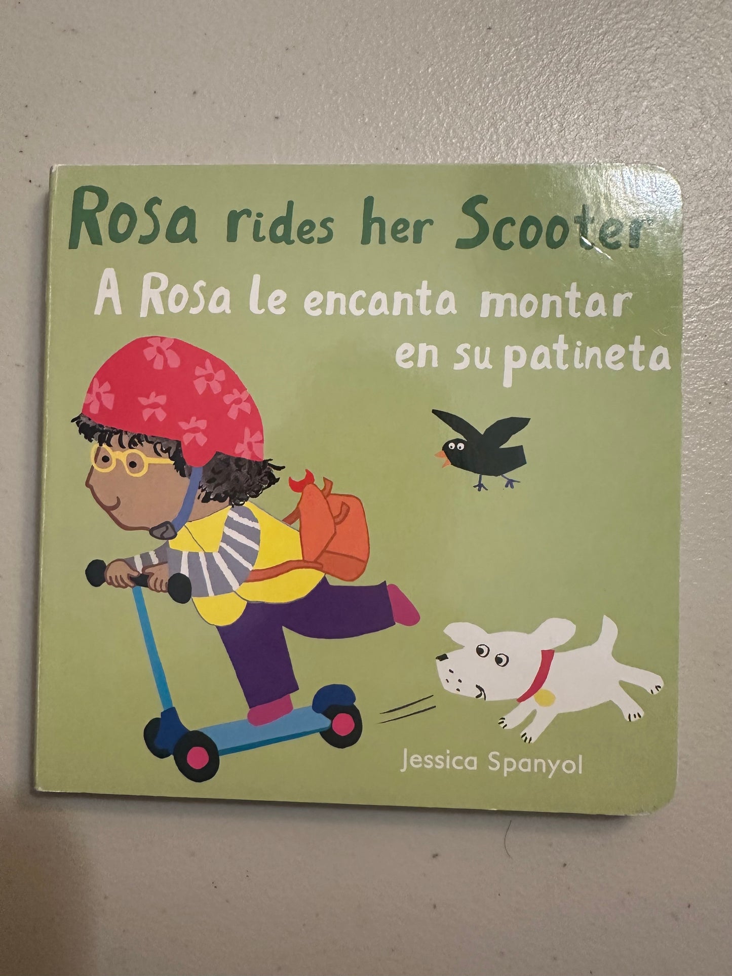 #85 Rosa Rides a Scooter Spanish Board Book