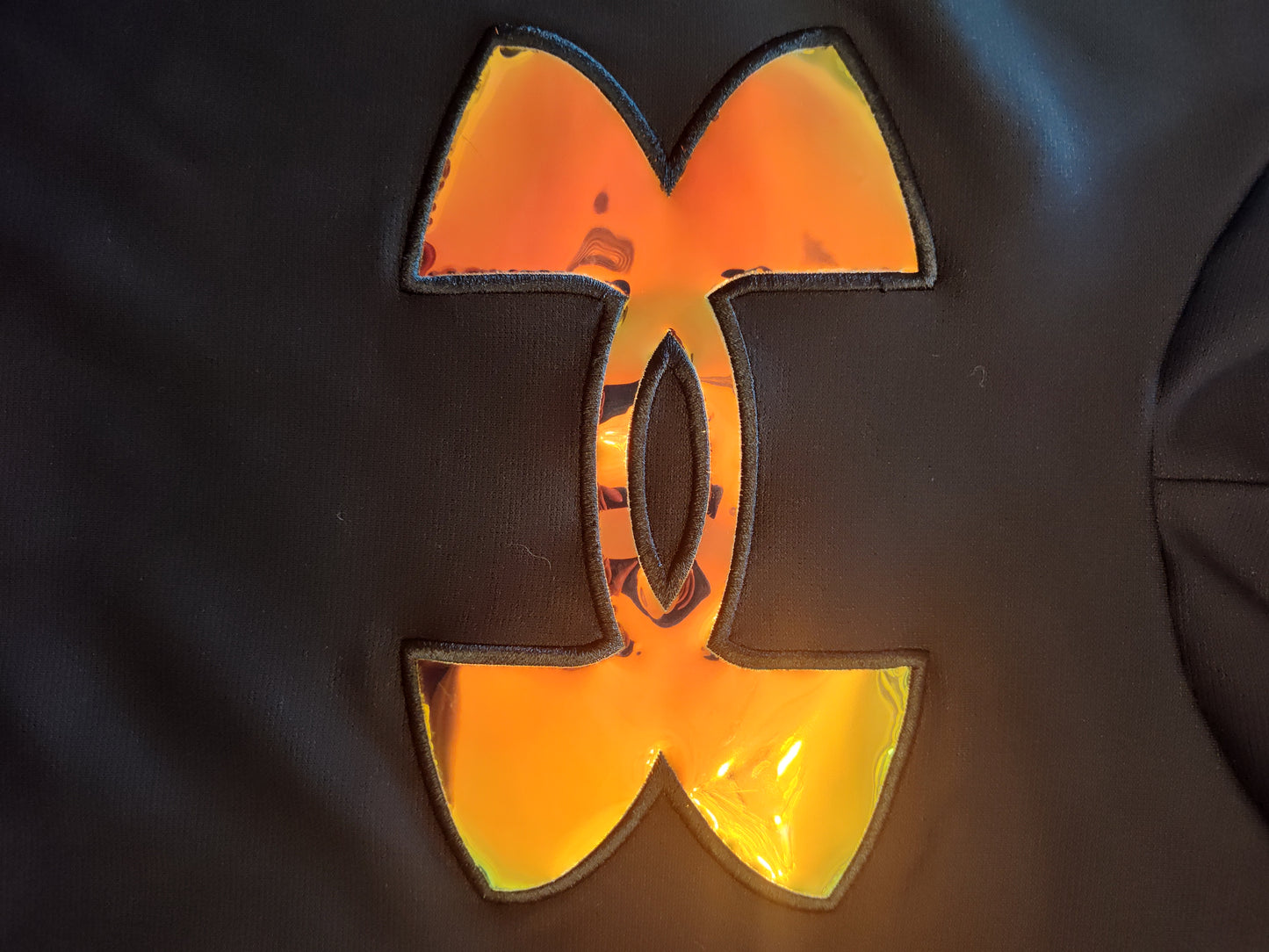 Seller 185: UA Girls YL (14/16) black hoodie with reflective symbol