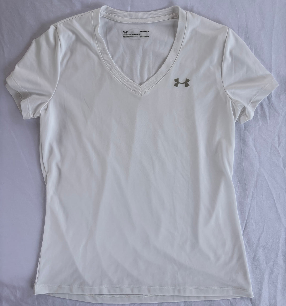 #119 Under Armor women's size medium white athletic top