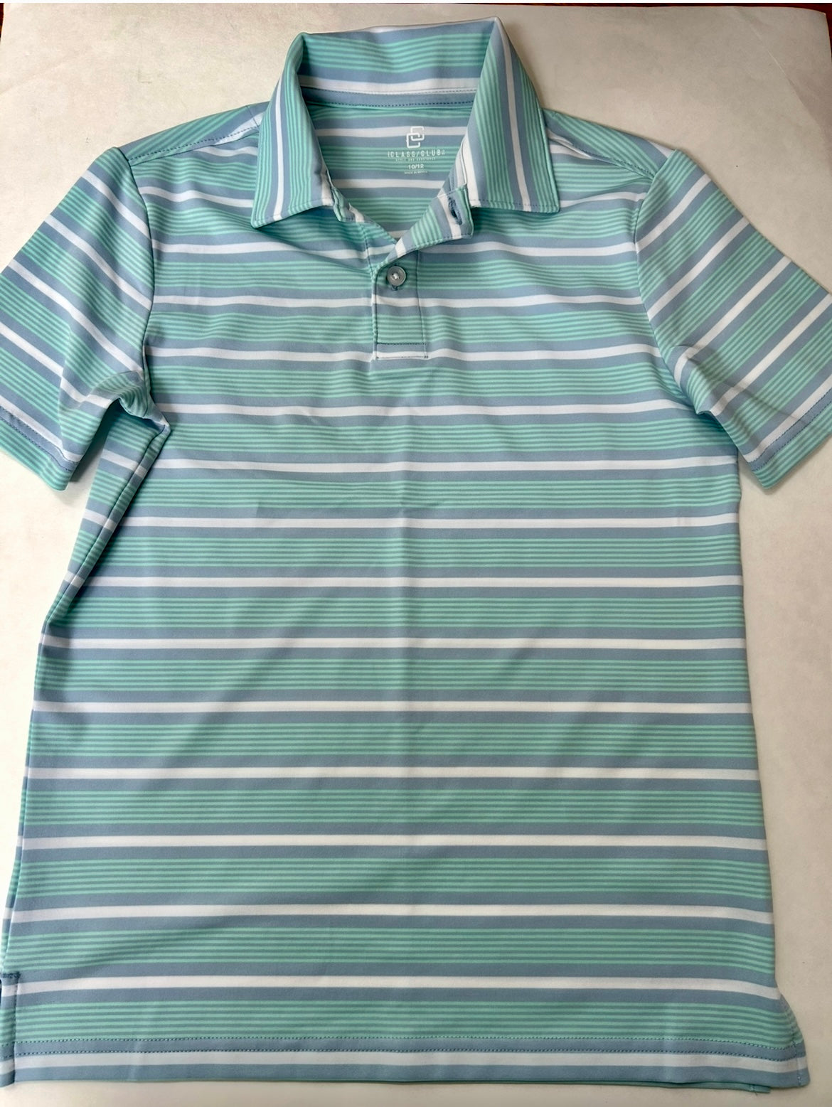 #95 Boys size 10-12 light blue striped dry fit polo