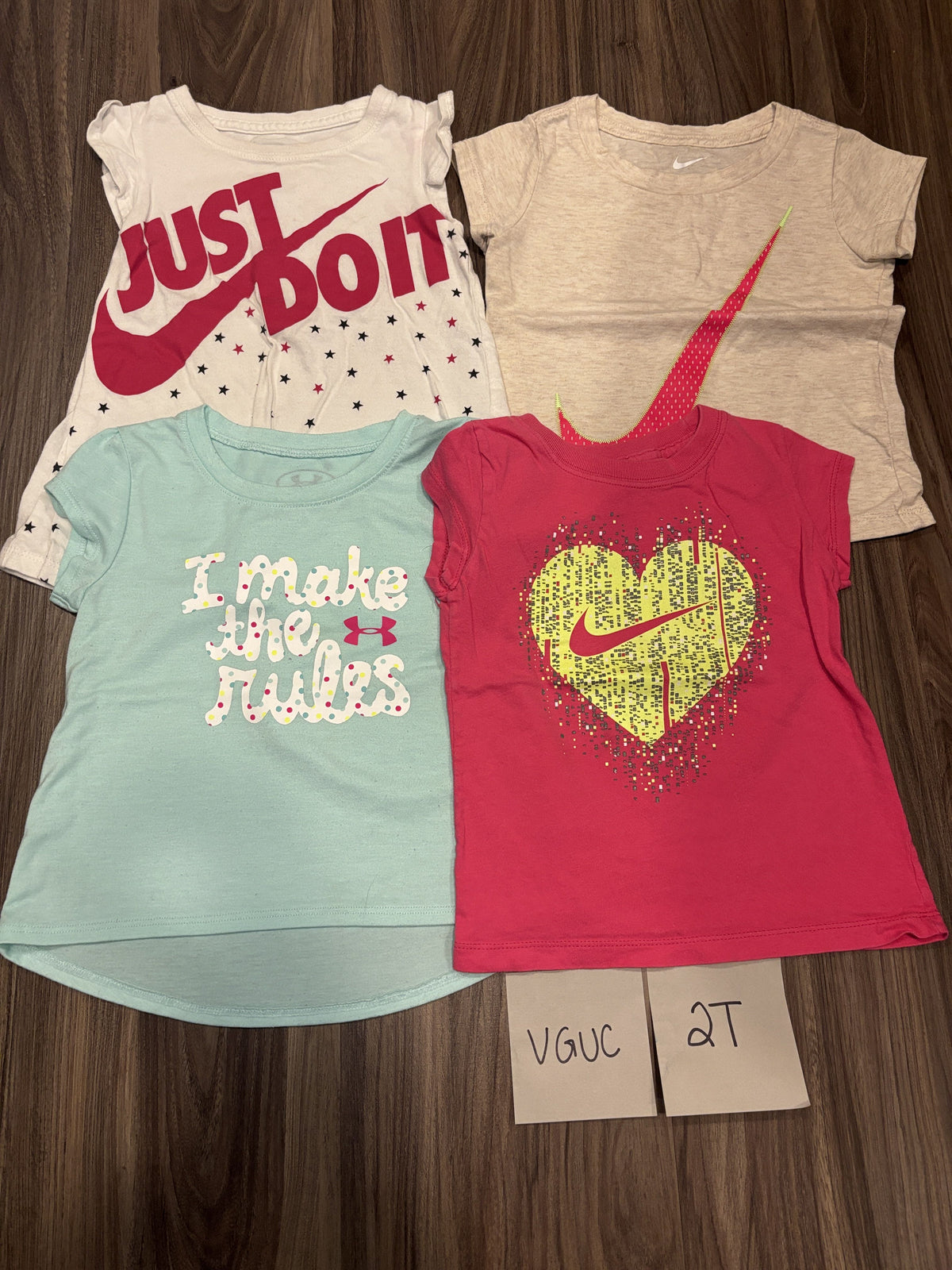#138 - 2T Nike VGUC (4) Tshirts (just do it, tan swoosh, teal, pink heart)