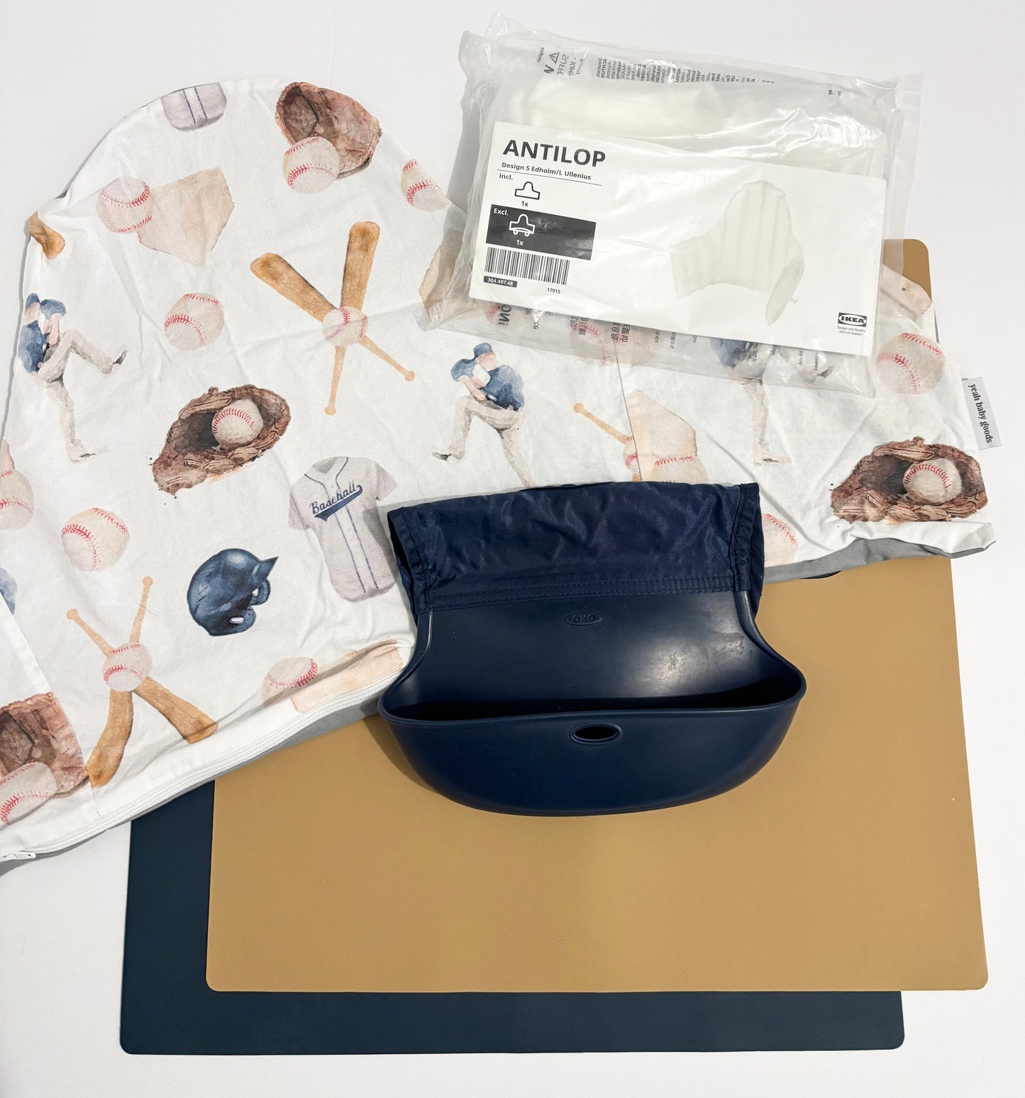 #132 - REDUCED- Bundle of YeahBabyGoods: Baseball Cushion Cover & Insert, 2 Silicone Placemats for IKEA Antilop in Golden Doe/Navy, + OxoTot Roll-Up Bib in Navy