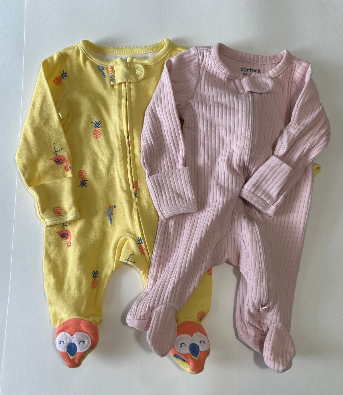 Seller 182. Newborn zip up sleepers.