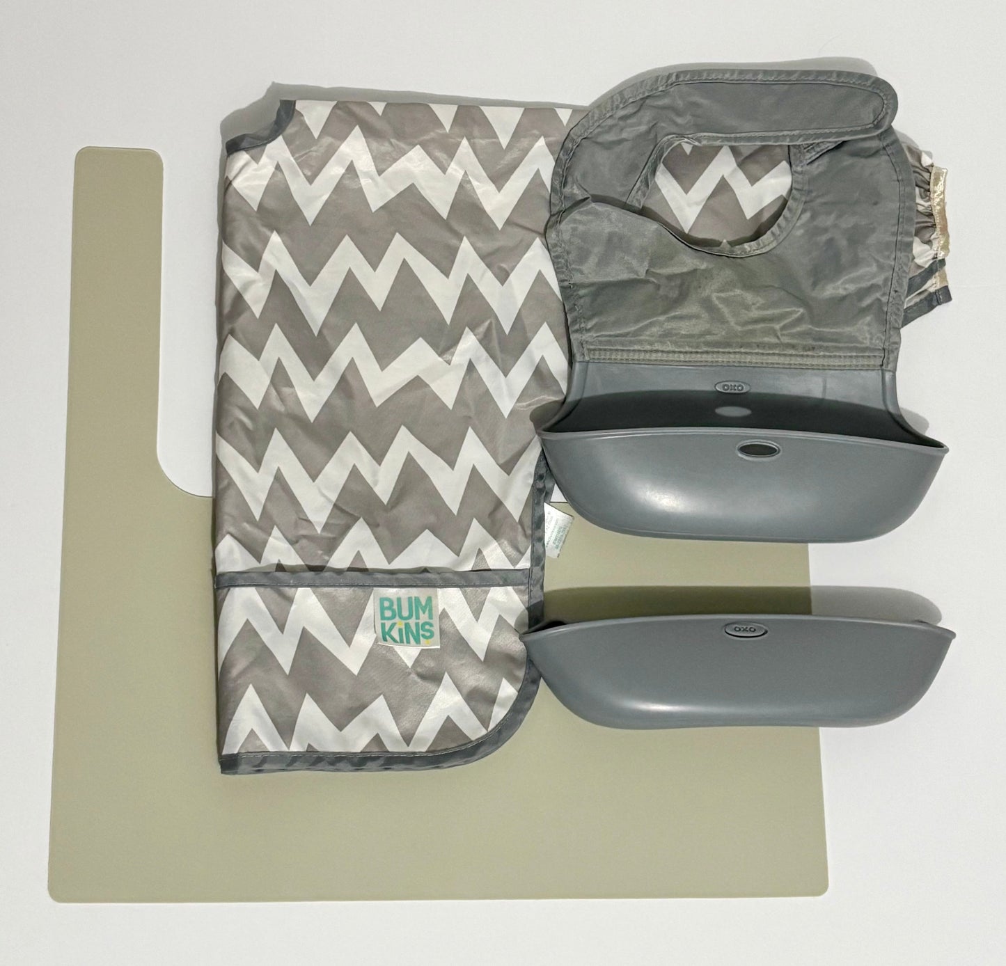 #132 - REDUCED- Bundle of YeahBabyGoods IKEA Highchair Placemat, Bumkins Long-Sleeved Bib, & 2 OxoTot Roll-Up Bibs