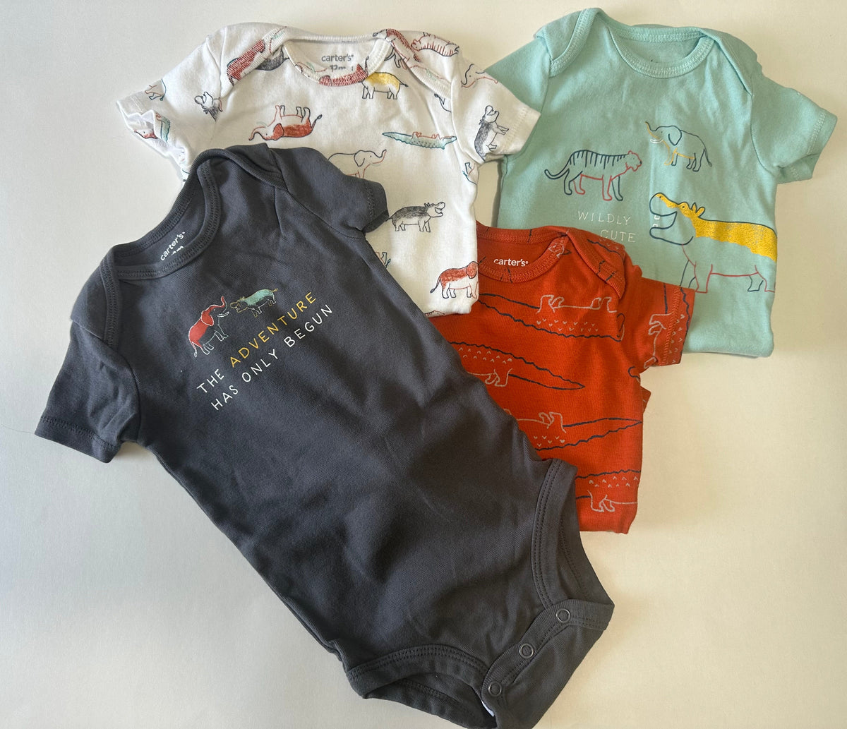 Seller 182. Carters 12 months. Boys. Onesies