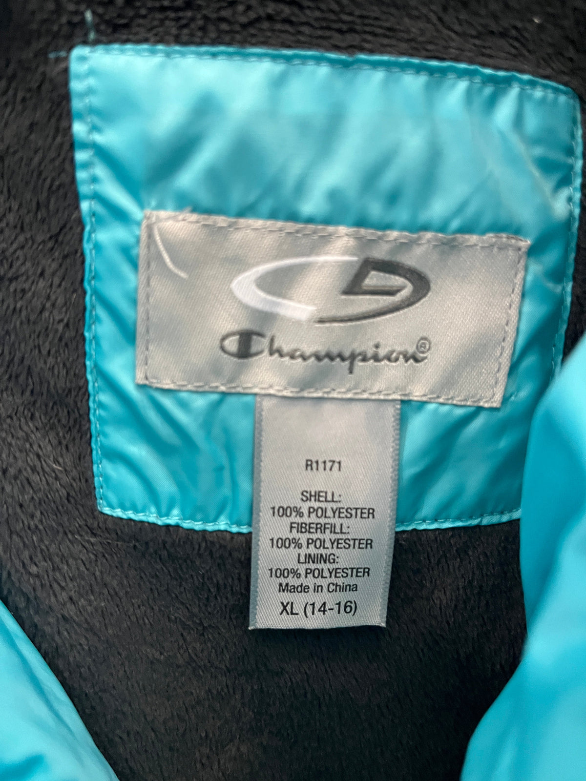 135 Girls turquoise Champion winter coat (see picture for dirt mark on sleeve) XL 14/16