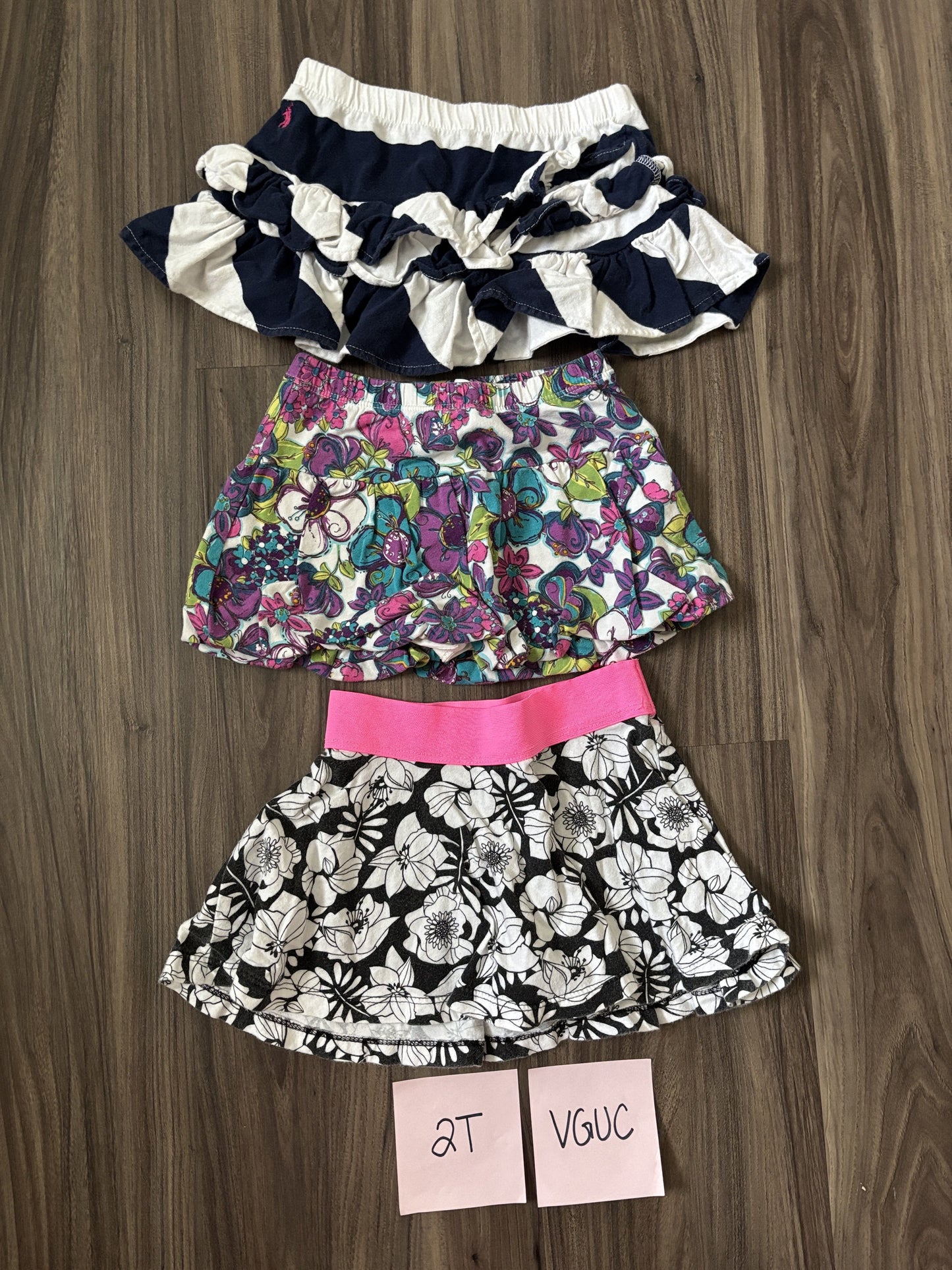 #77 - 2T VGUC 3 Skirts (navy/white, purple floral, black/white floral)