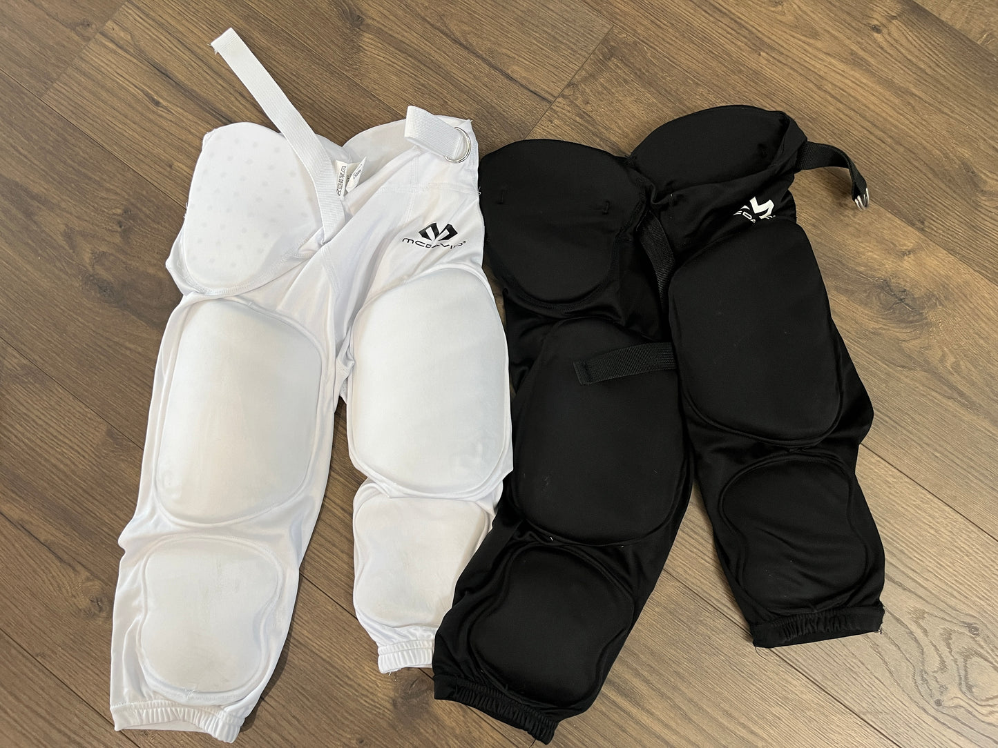 137 McDavid Brand Youth boys Medium white and black football pants, no holes