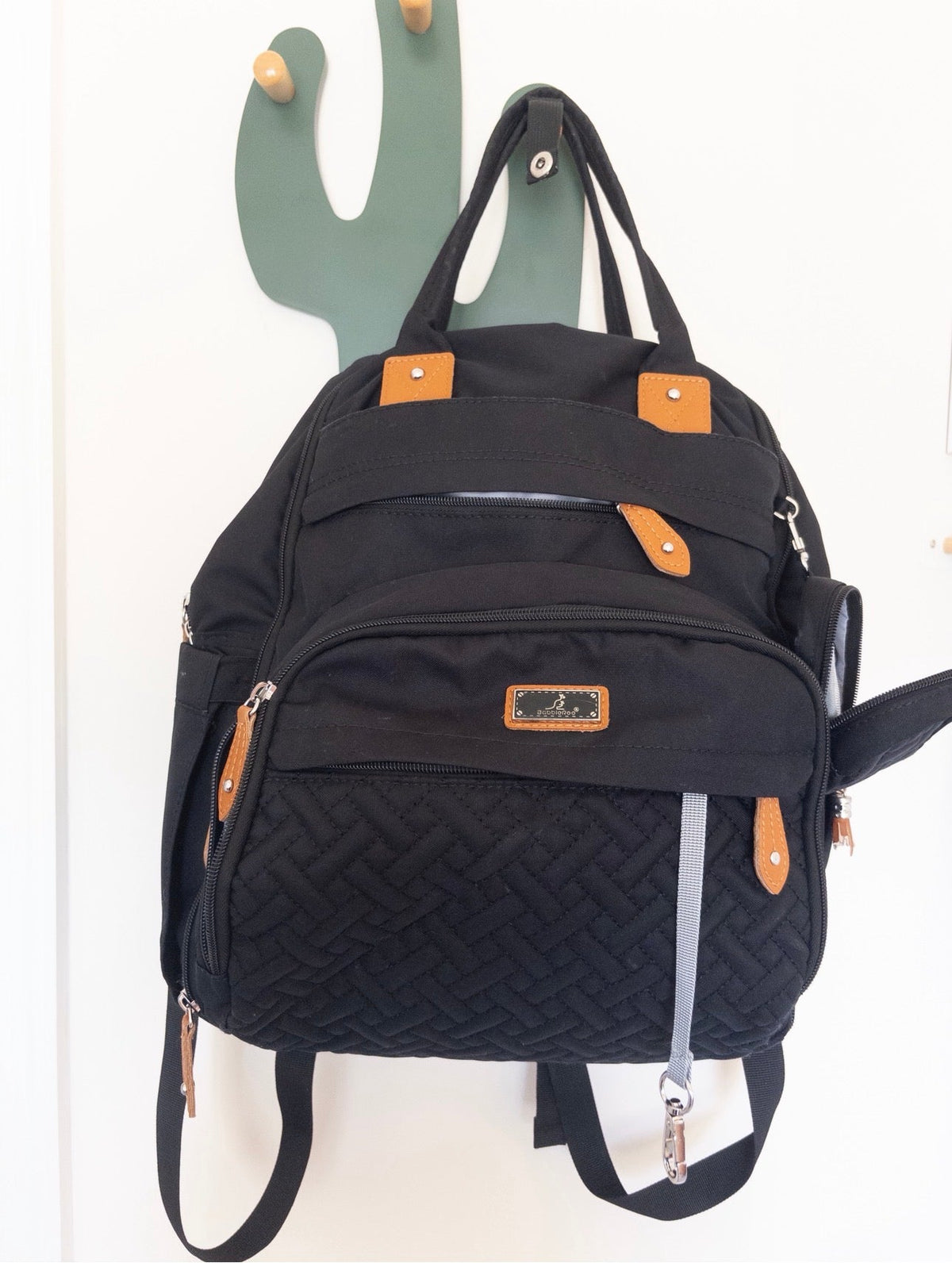 #36- Black diaper bag with multiple zippers. GUC