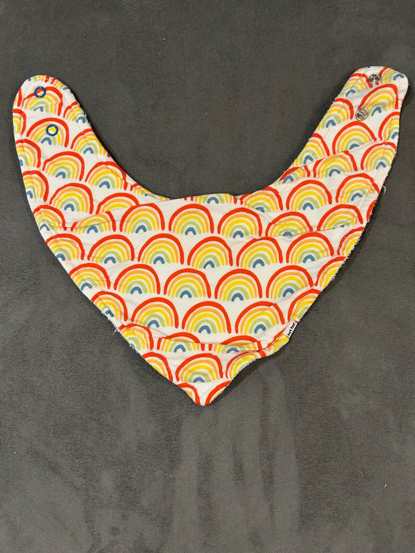 Seller 128 - Little Sleepies Primary Rainbows Bib