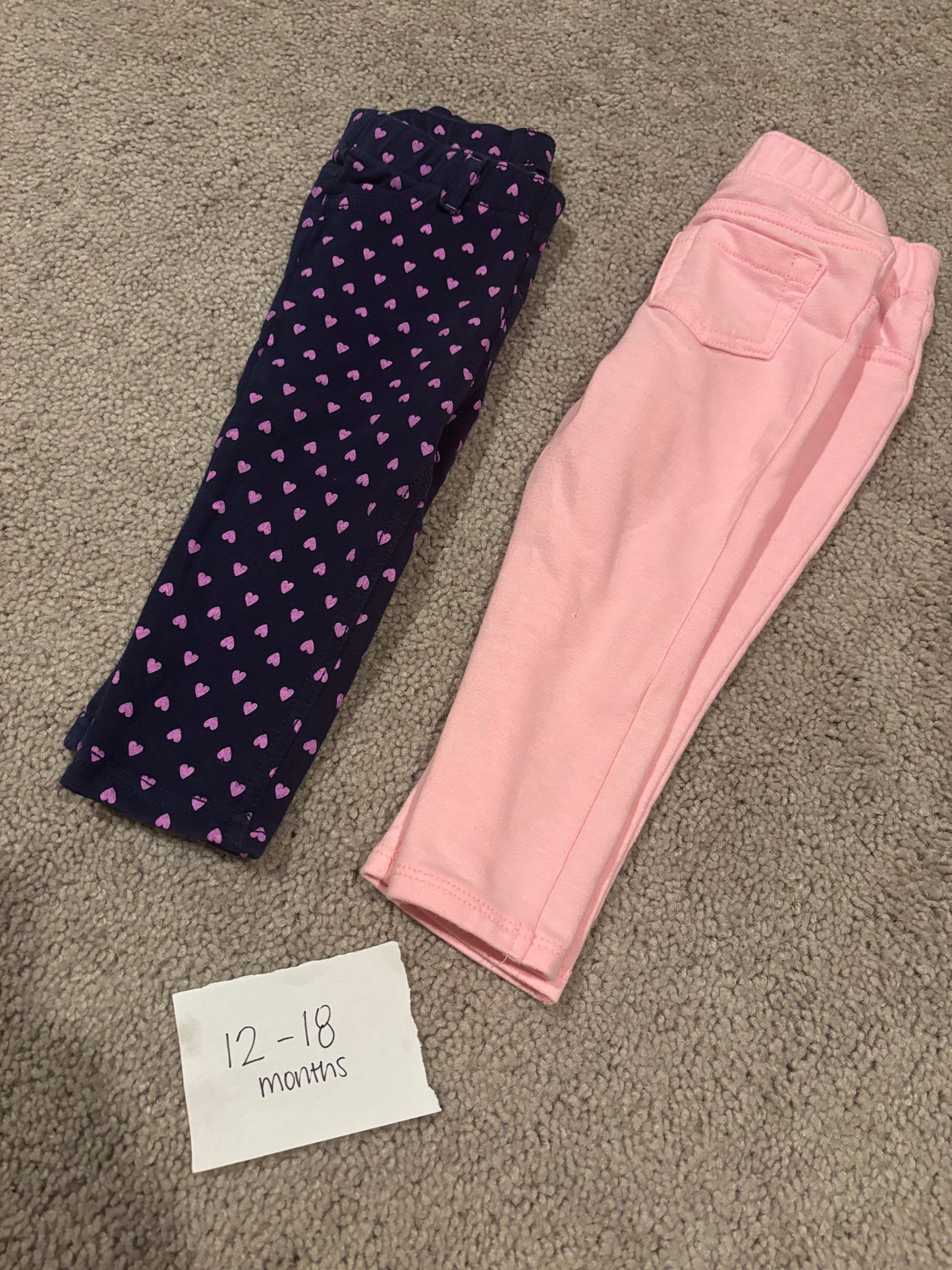 #138 - 12-18 Mo - VGUC 2 Pair Pants (Navy with pink hearts + Pink) - PU 45236