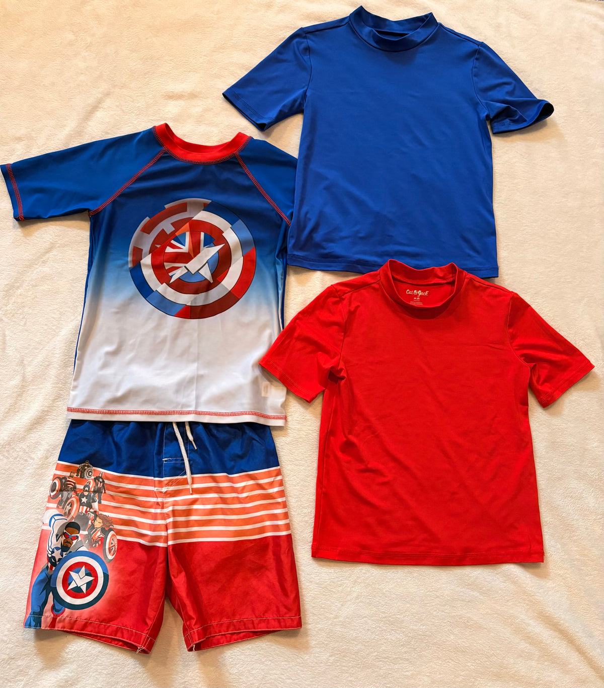 #102 - boys size M/8 Captain America swim trunks and 3 swim shirts
