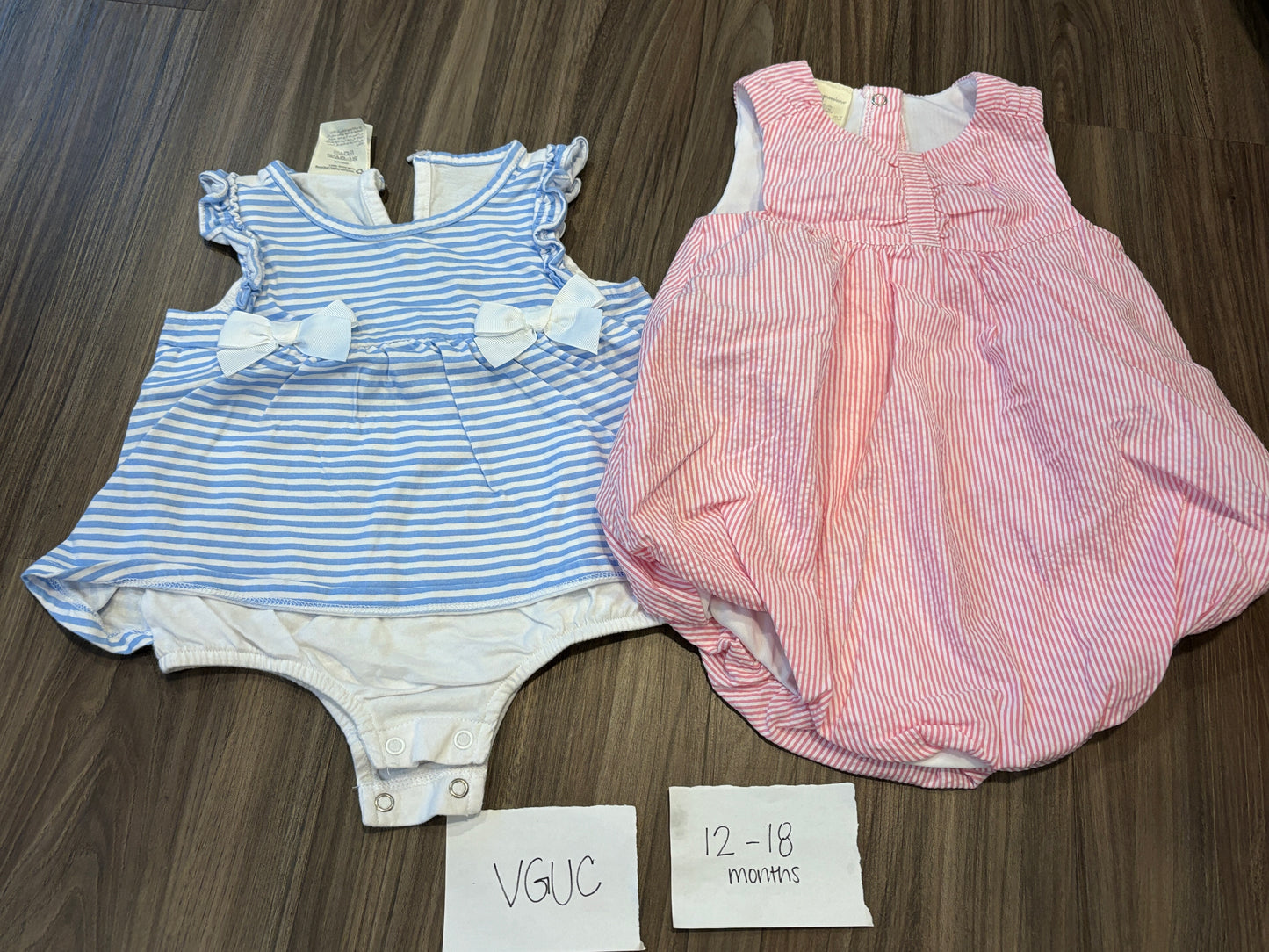 #77 - 12-18 Mo - VGUC First Impressions - 2 Striped bodysuits (blue + pink)