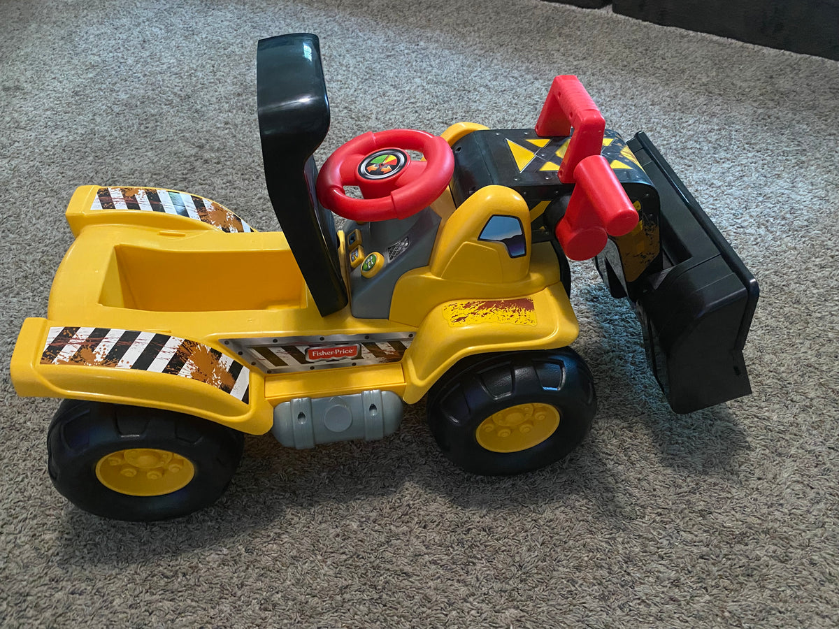 Seller #57 Fisher Price Ride on tractor