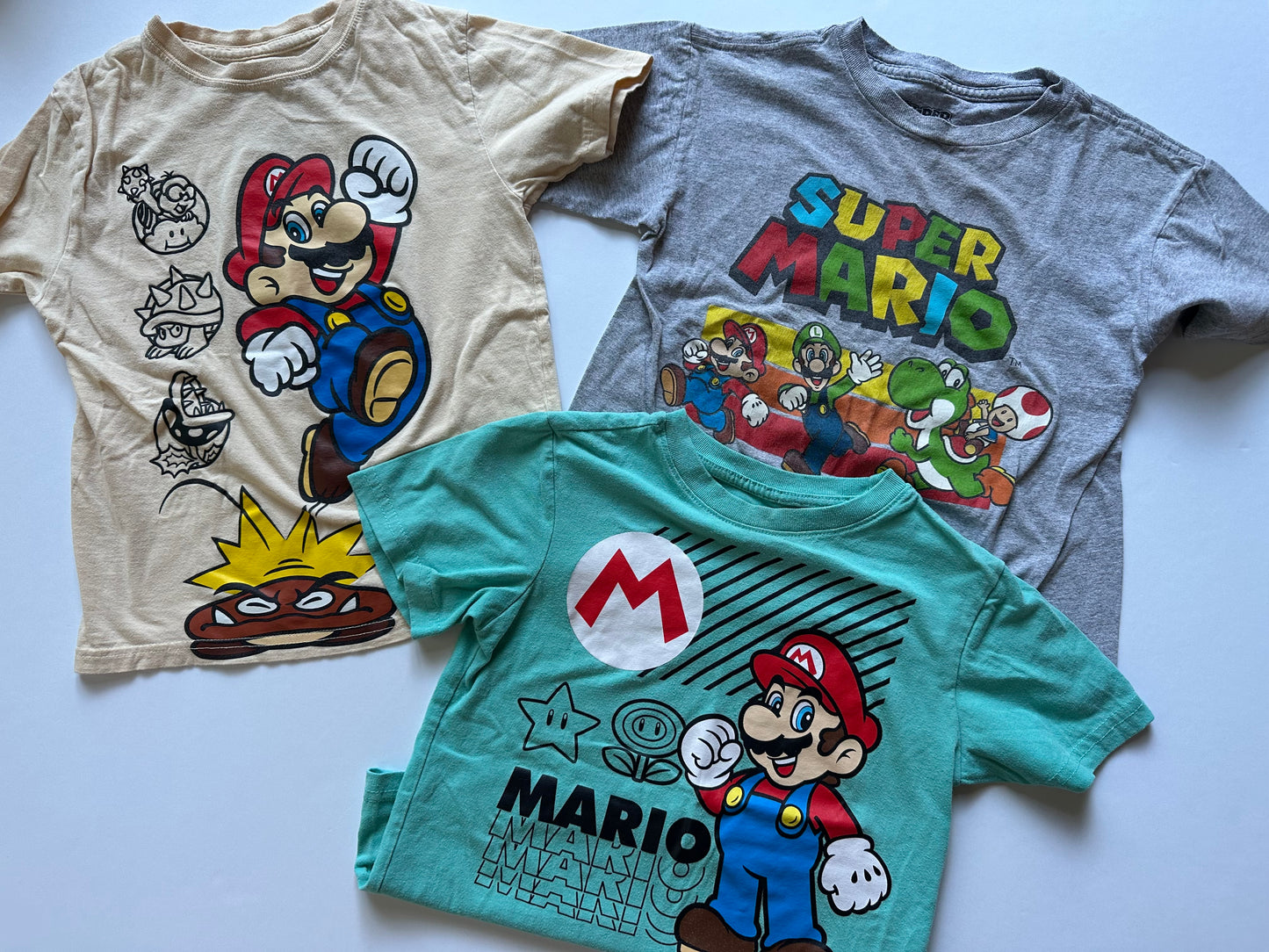 #104 Boy 6/7 shirt bundle Super Mario - fit more like 6 overall IMO