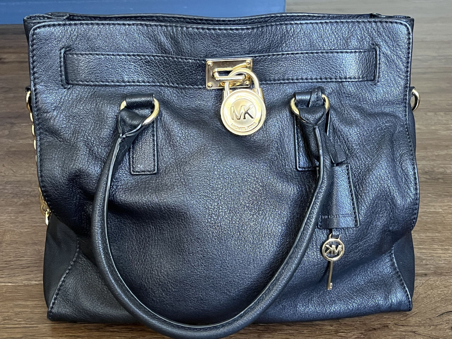 #124 Michael Kors Black Purse with gold accents