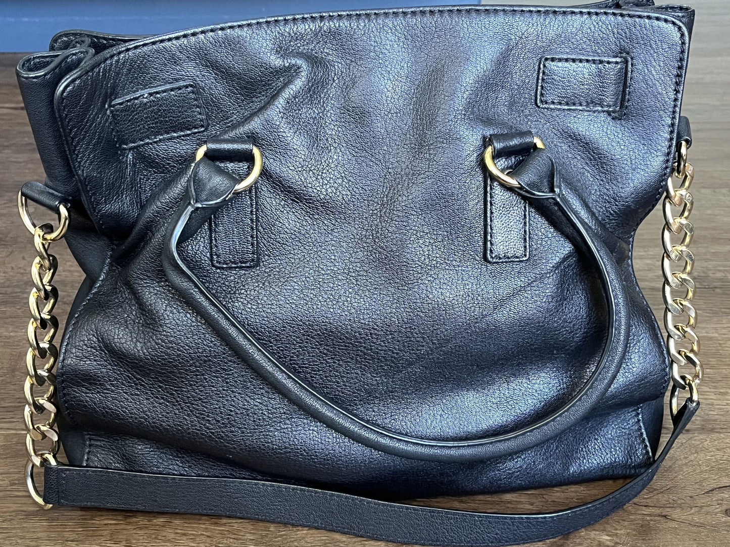 #124 Michael Kors Black Purse with gold accents