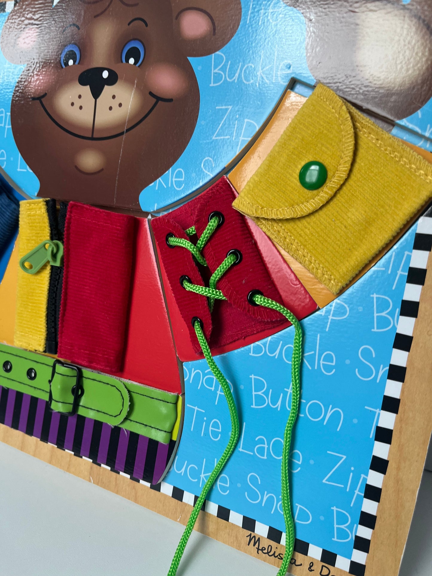 #7 Melissa and Doug basic skills board - fine motor skills