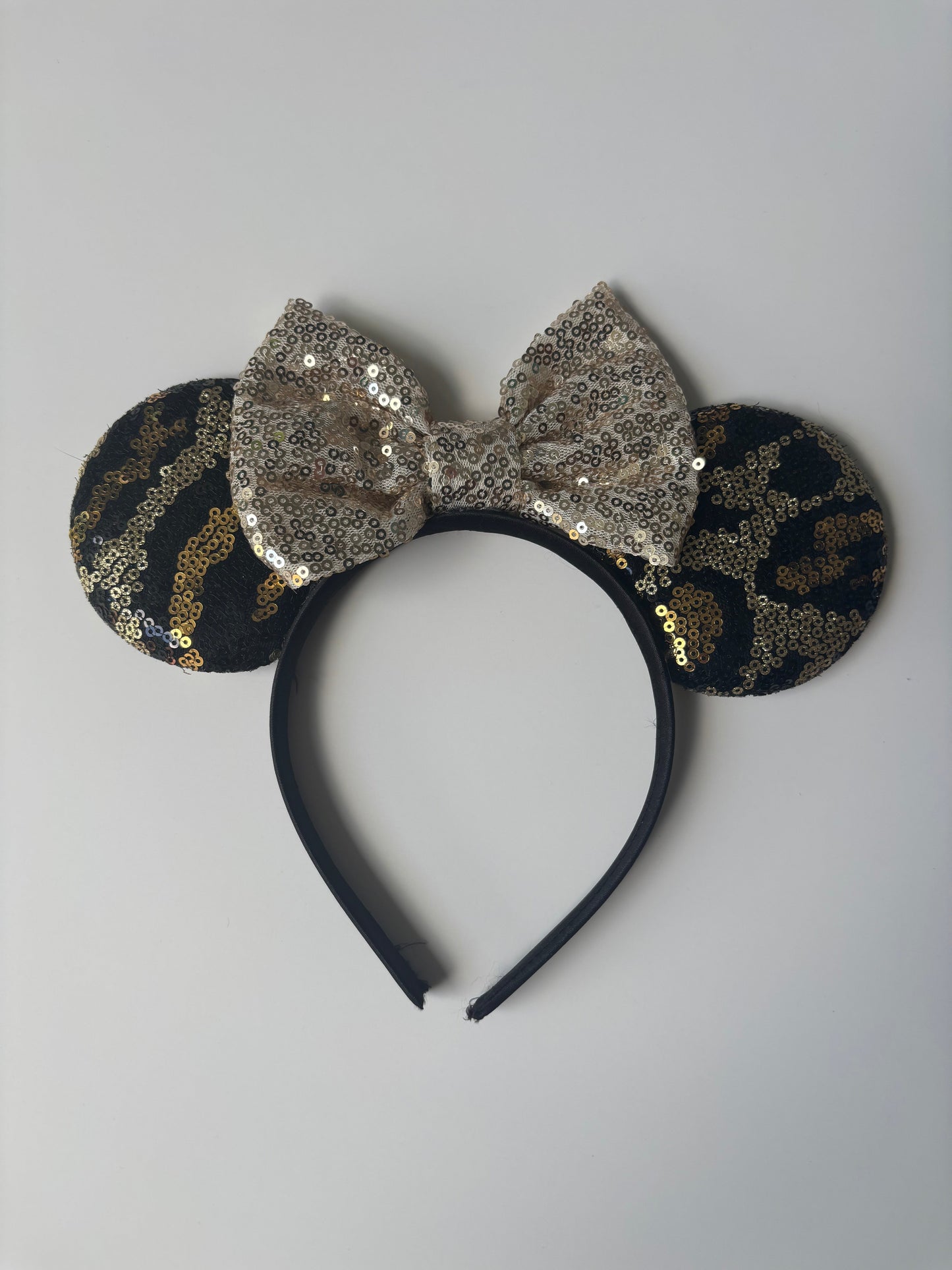 Seller #50 Sequin Animal Print Minnie Ears EUC