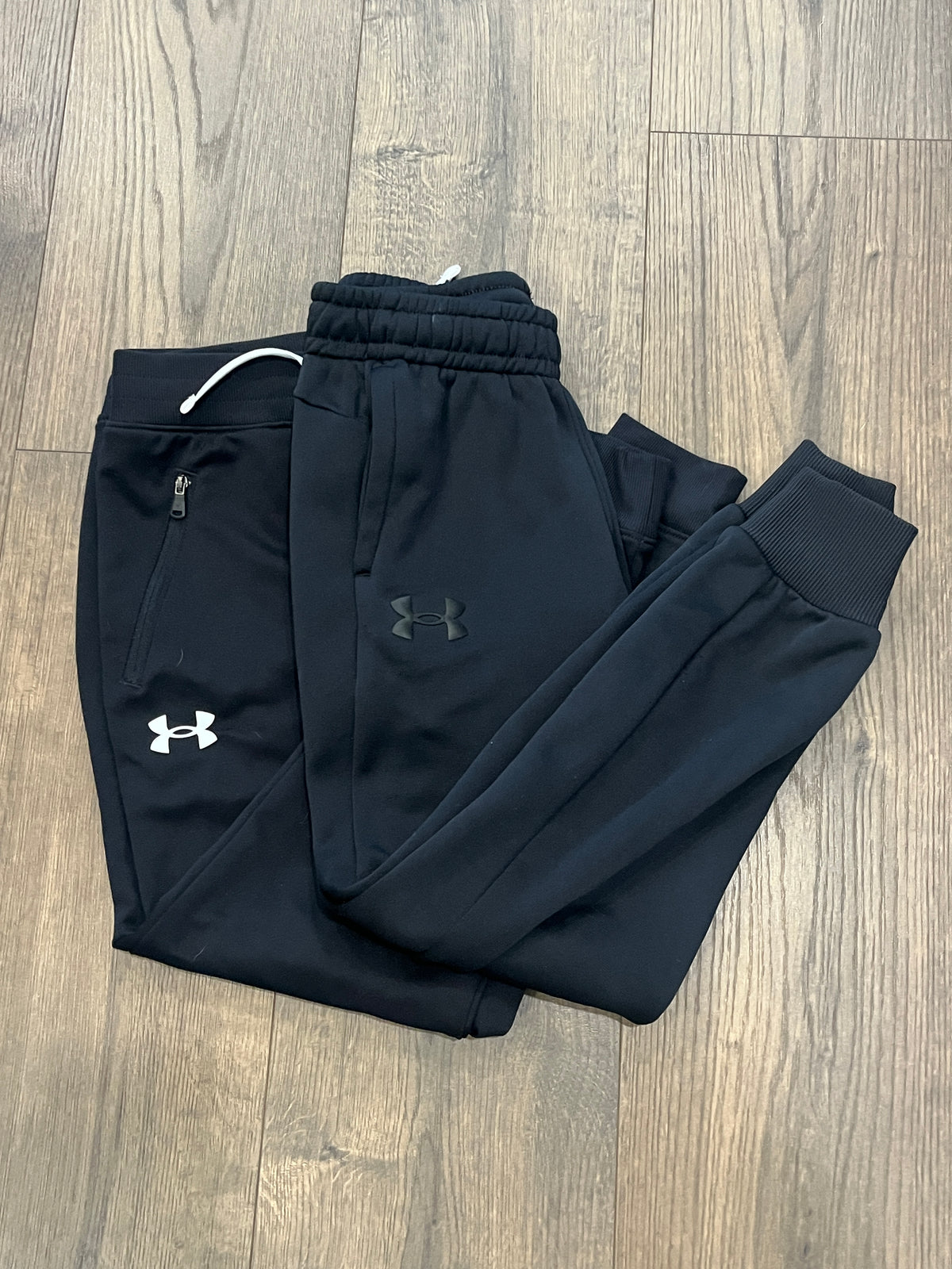 135 Boys YS, 2 pairs of Under Armour black jogger pants, EUC