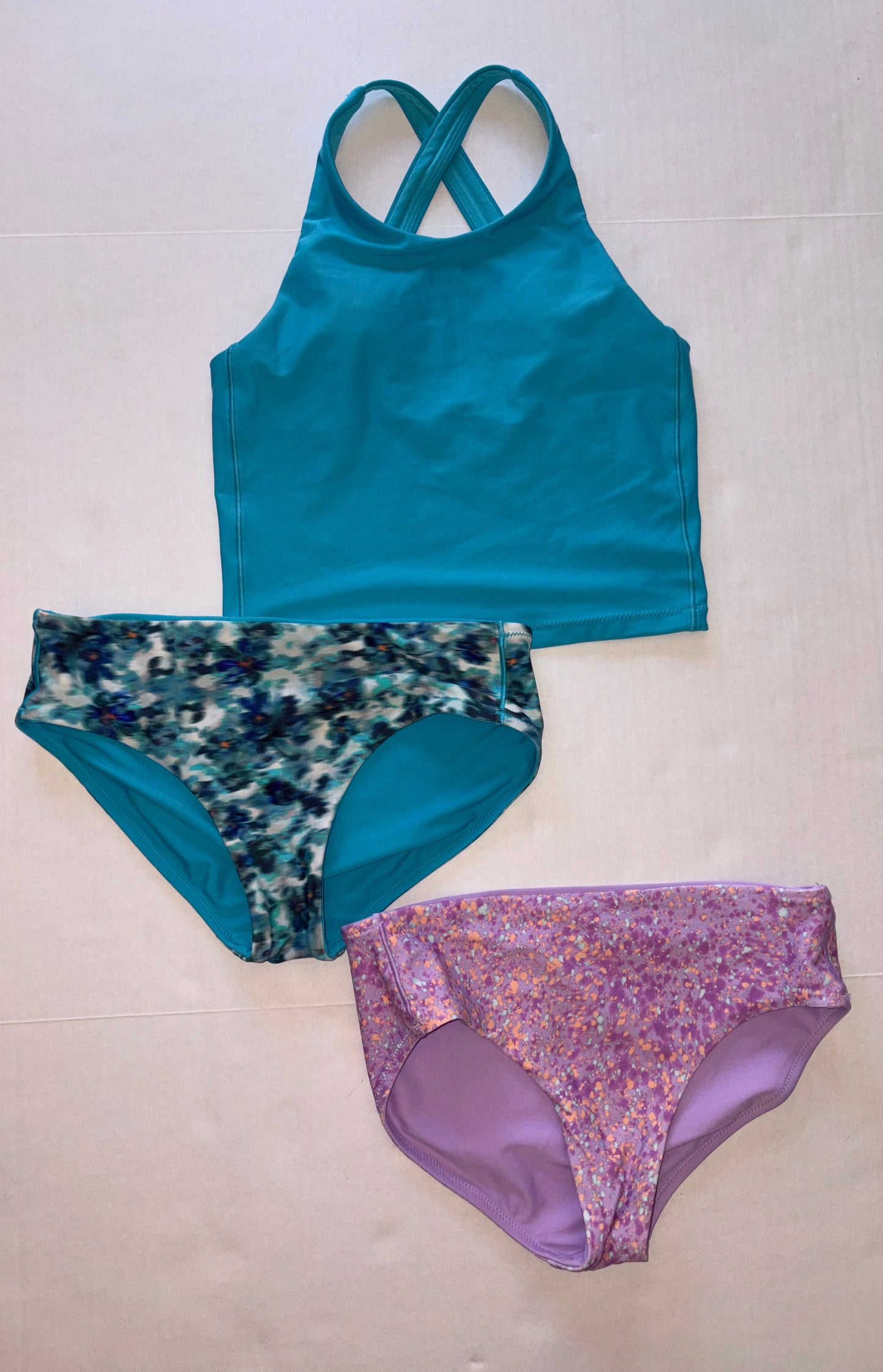 Seller 118 VGUC Athleta Girl 3 piece swim lot. Bottoms are reversible. Size 12