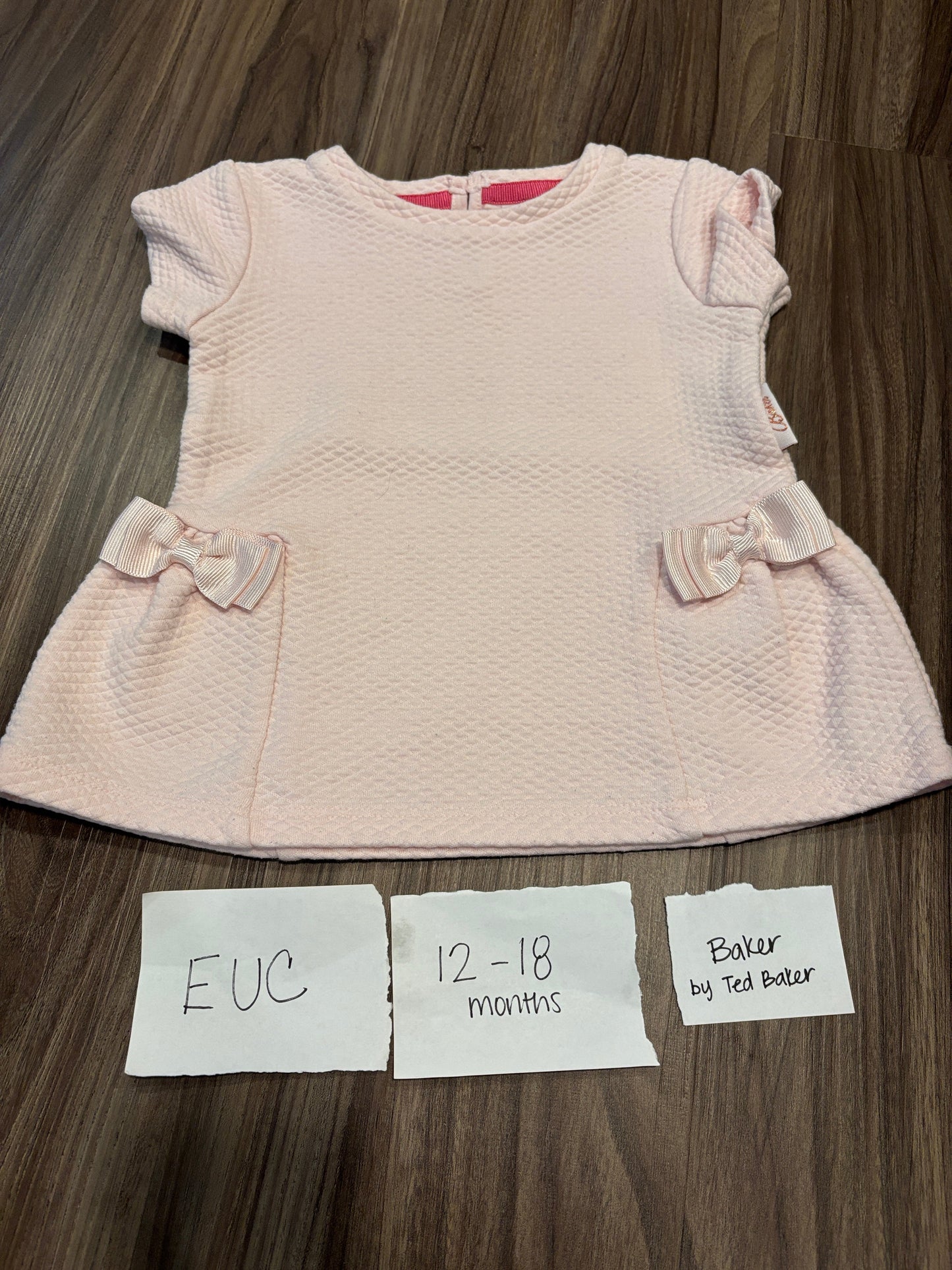 #77 - 12-18 Mo - EUC Baker - Pink Shirt with Bows