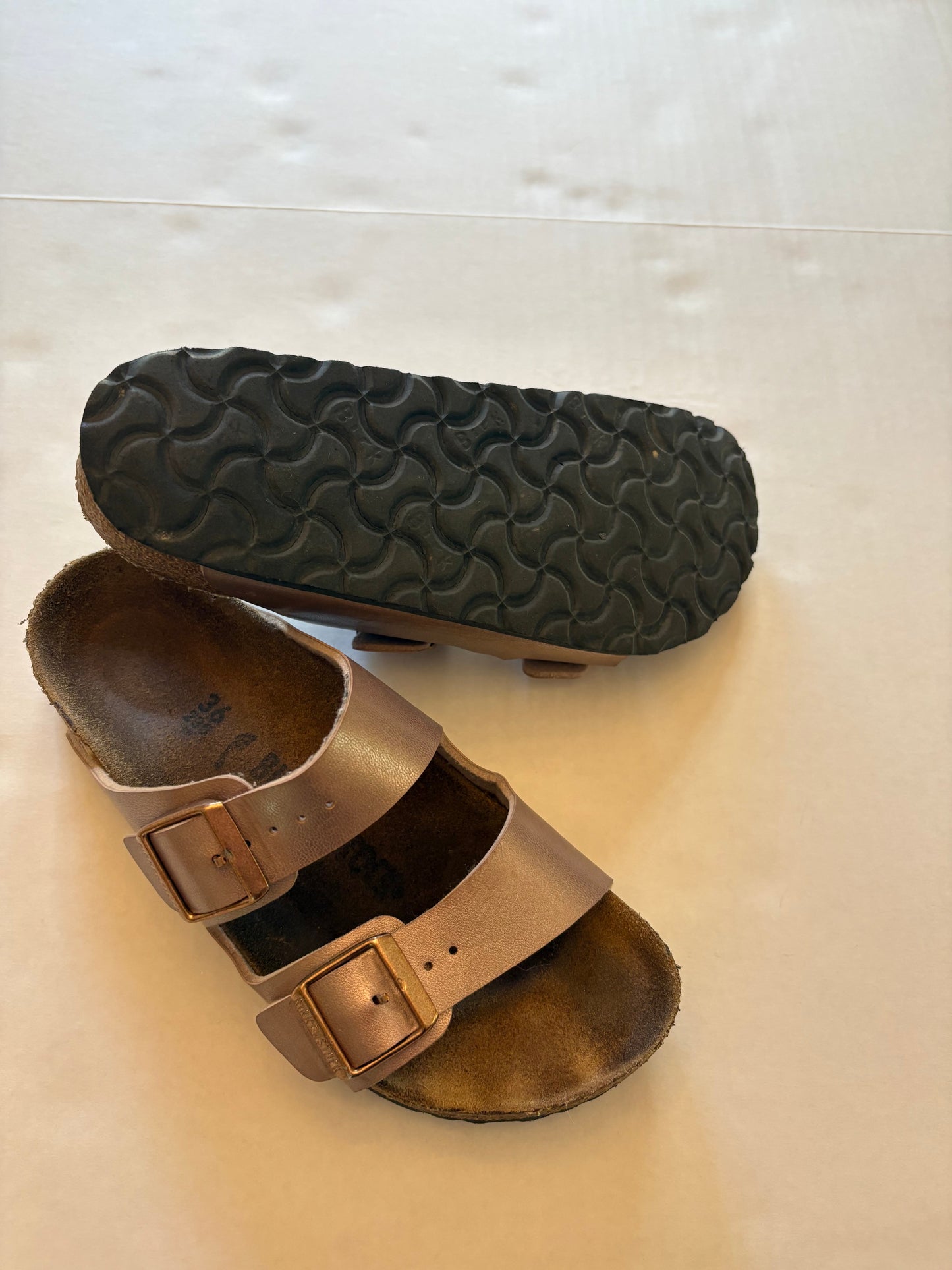 PPU 45227 Seller 121 VGUC Rose Gold Birkenstocks size 36. My daughter felt like they fit small more like her 35s(4.5youth)