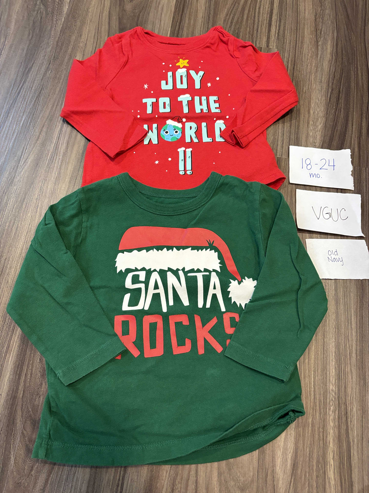 #138 - 18-24 Mo VGUC Old Navy (2) Christmas Shirts (Joy + Santa Rocks)