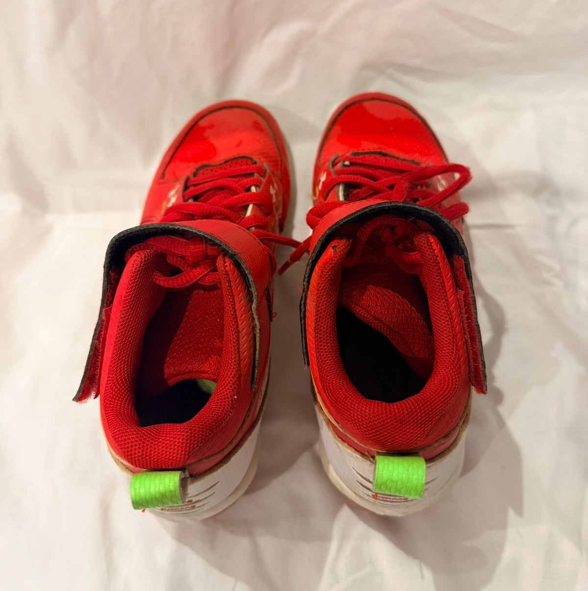 #143 Under Armour youth high-top baseball cleats, size 3