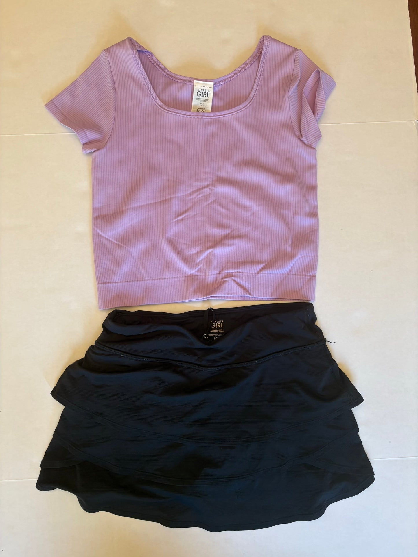 Seller 118 VGUC Athleta Girl black skort and lavender ribbed crop tee. Size 12