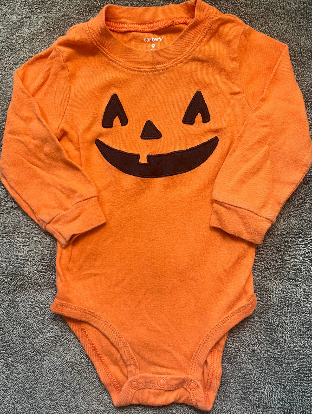 Seller #13 Carter’s gender neutral 9 months Jack o lantern onesie