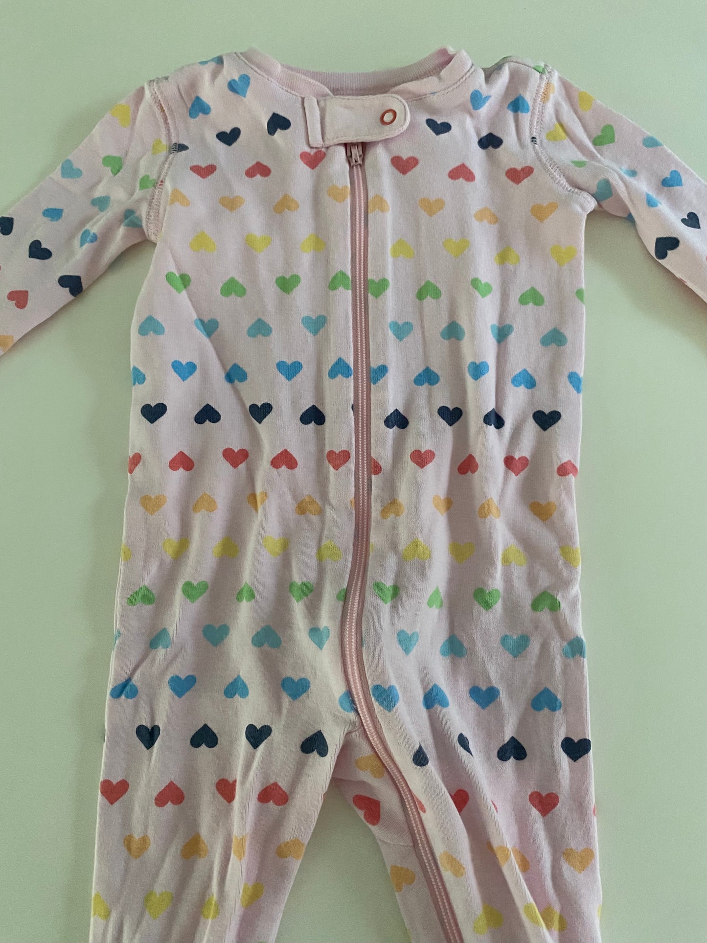 #117- Girls 6-9M, Primary Pink Rainbow Heart Footed Pajamas, EUC