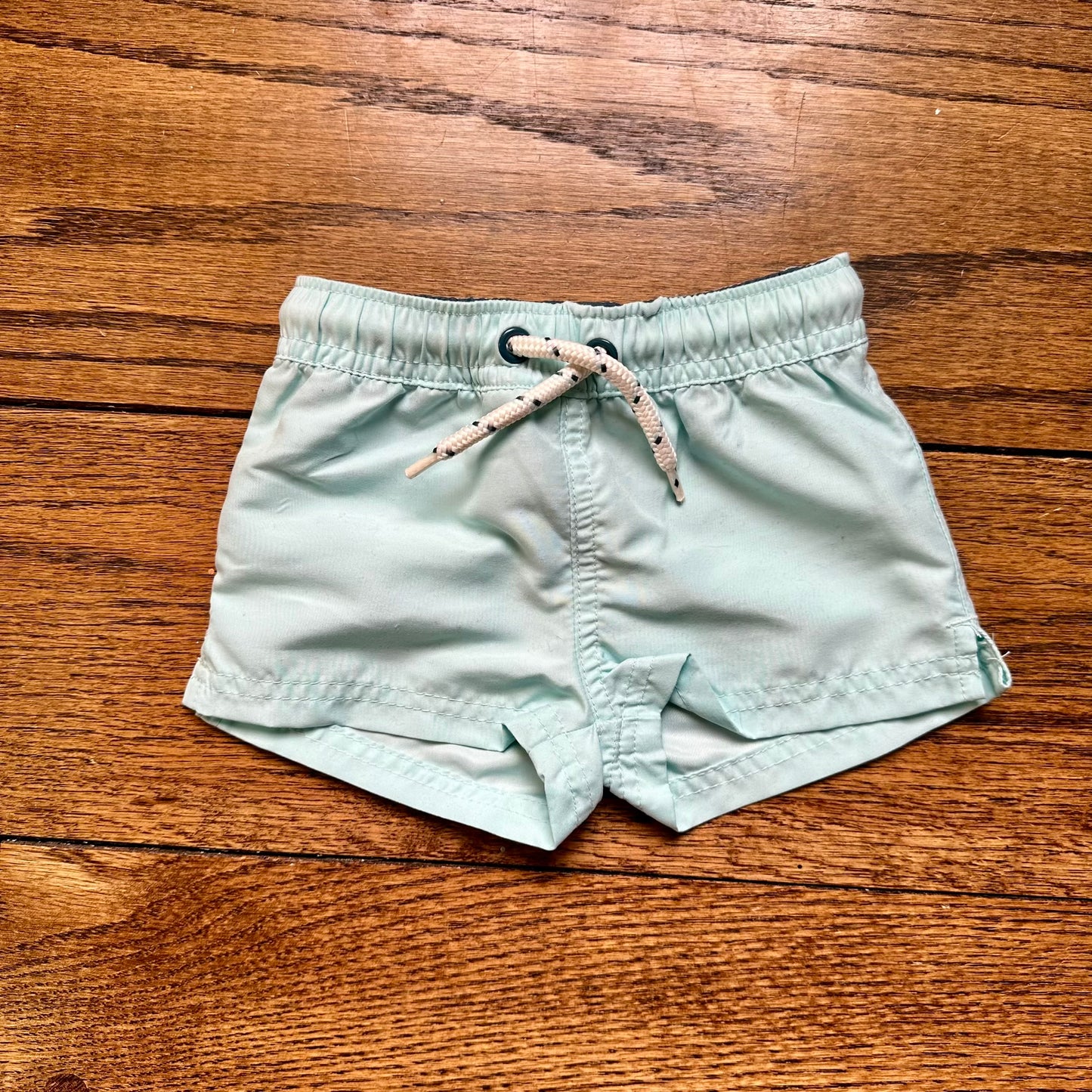#95 EUC Boys Little Planet Teal Swim Shorts, size 9 months