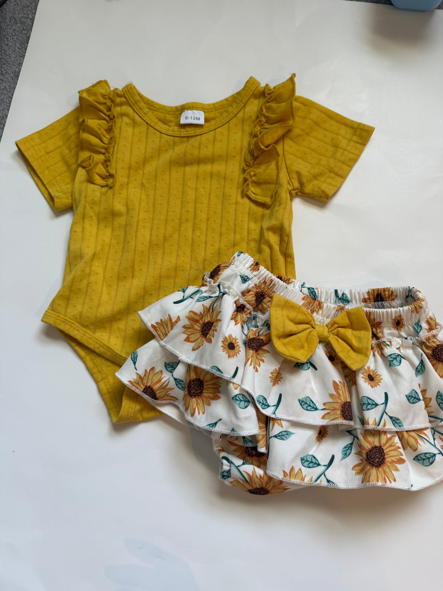 #116 Girls sunflower skort and yellow ruffle onesie girls size 6-12 months