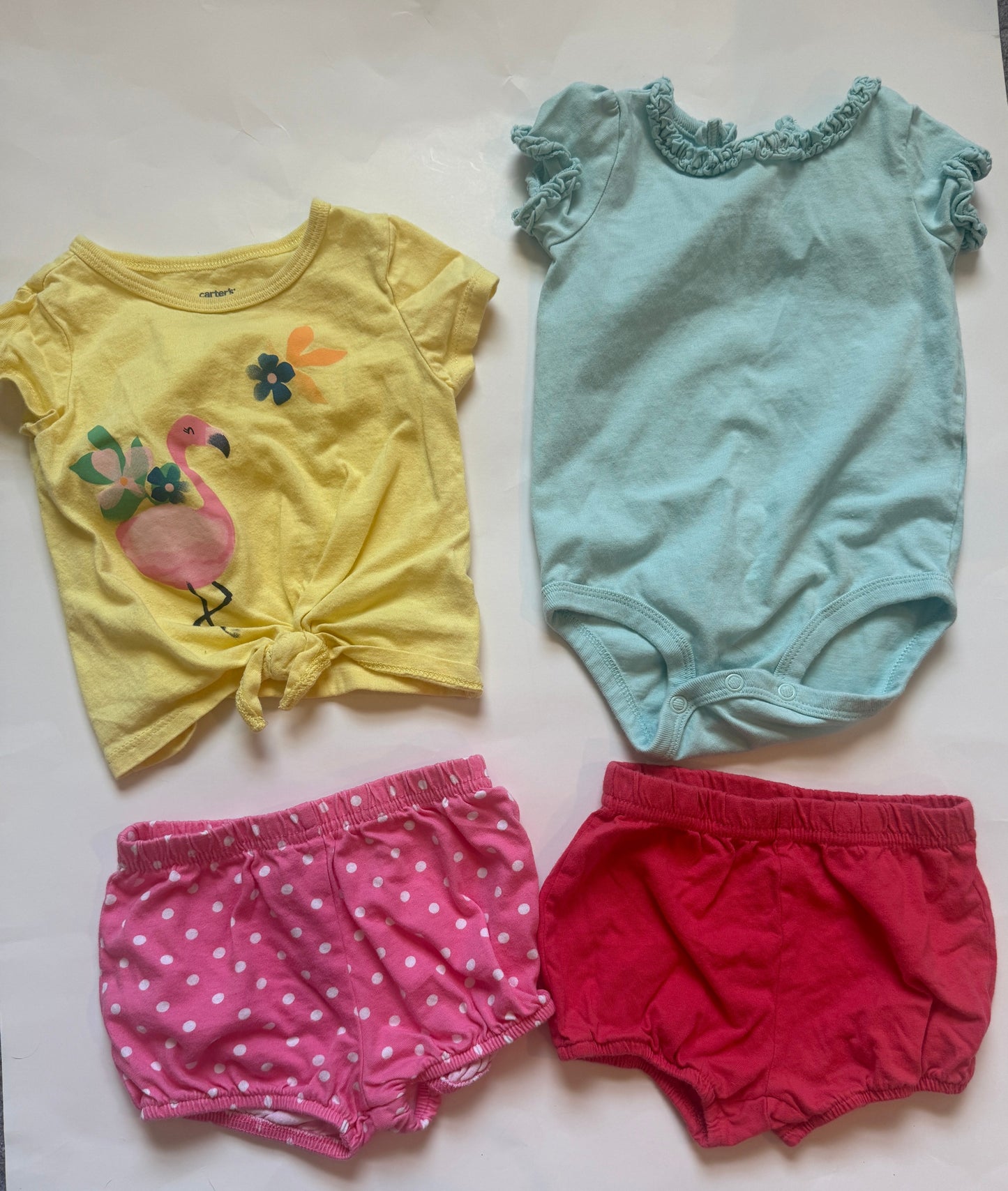 Carters outfit bundle ( coral shorts, pink polka dot shorts, flamingo shirt, blue ruffle onesie) girls 9 months