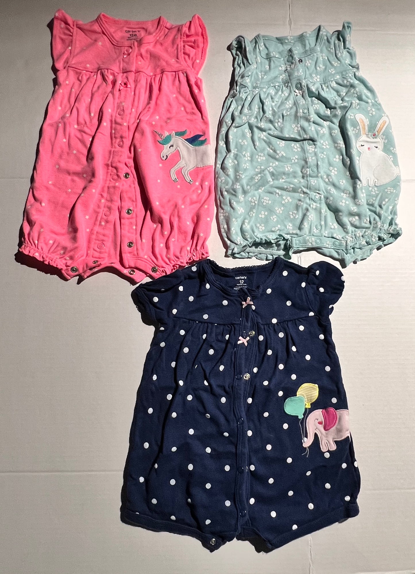 #100 Girls 12mo Rompers