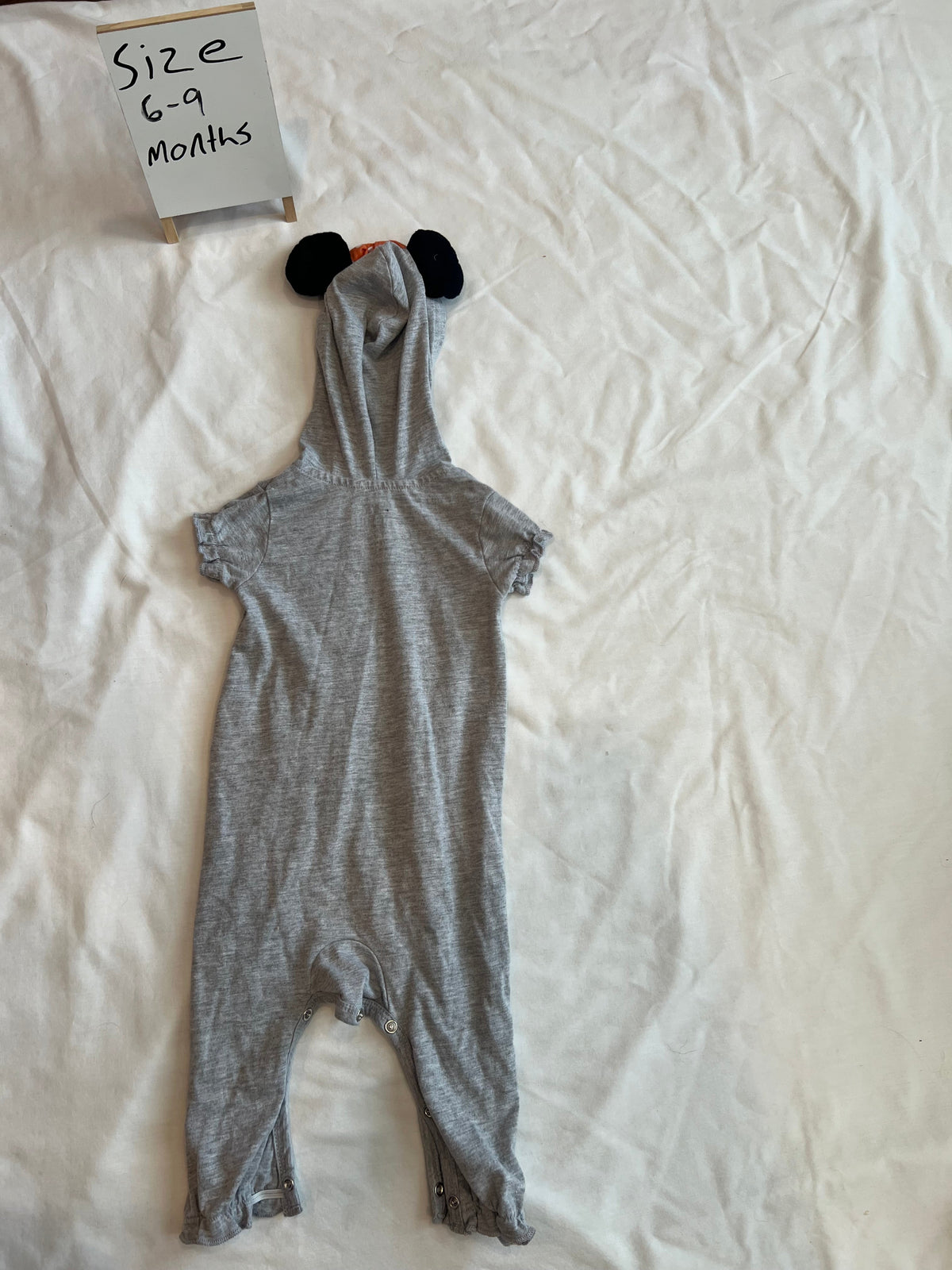 #24 size 6-9 months onesie