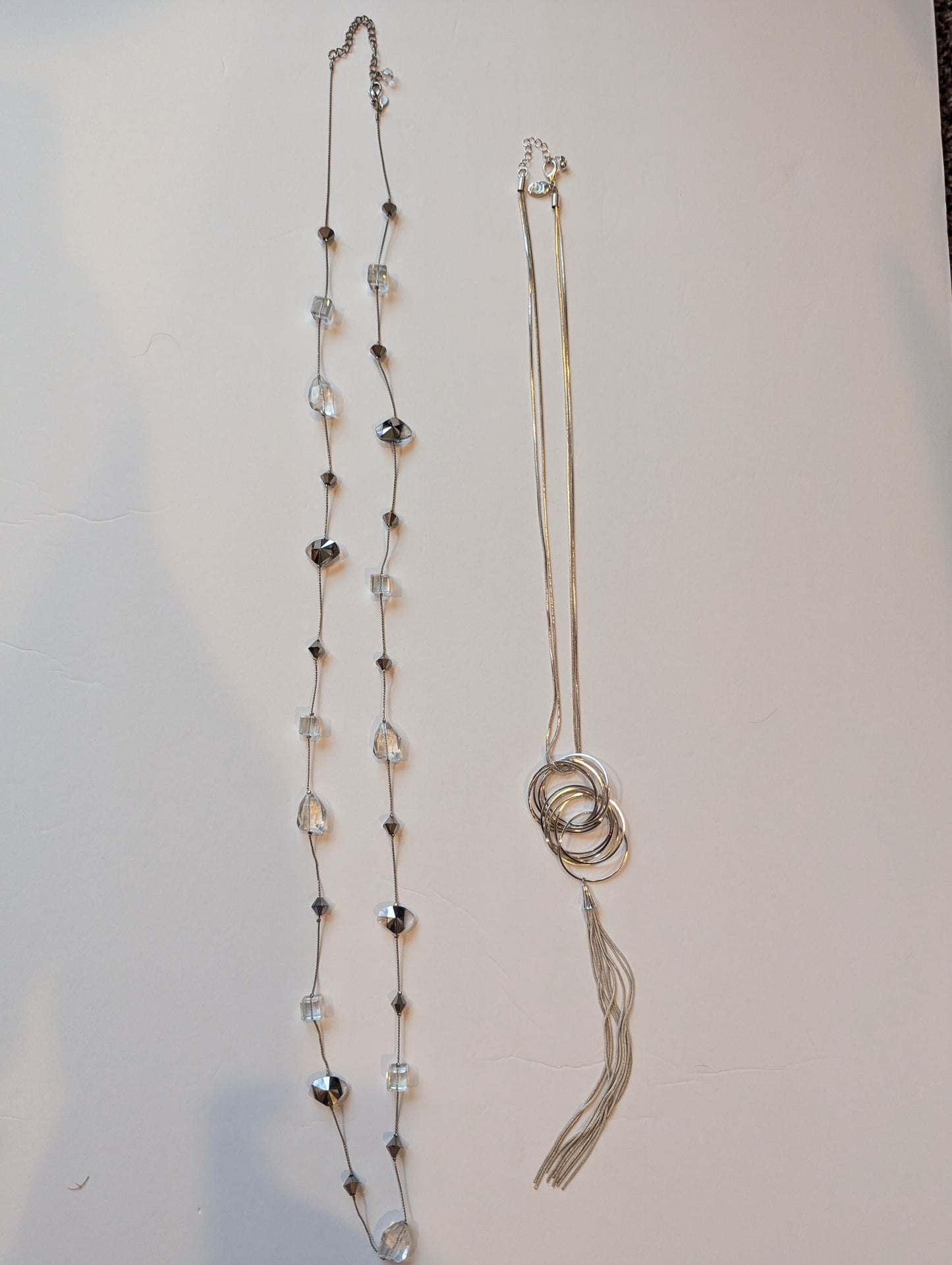 #17 2 silver long necklaces